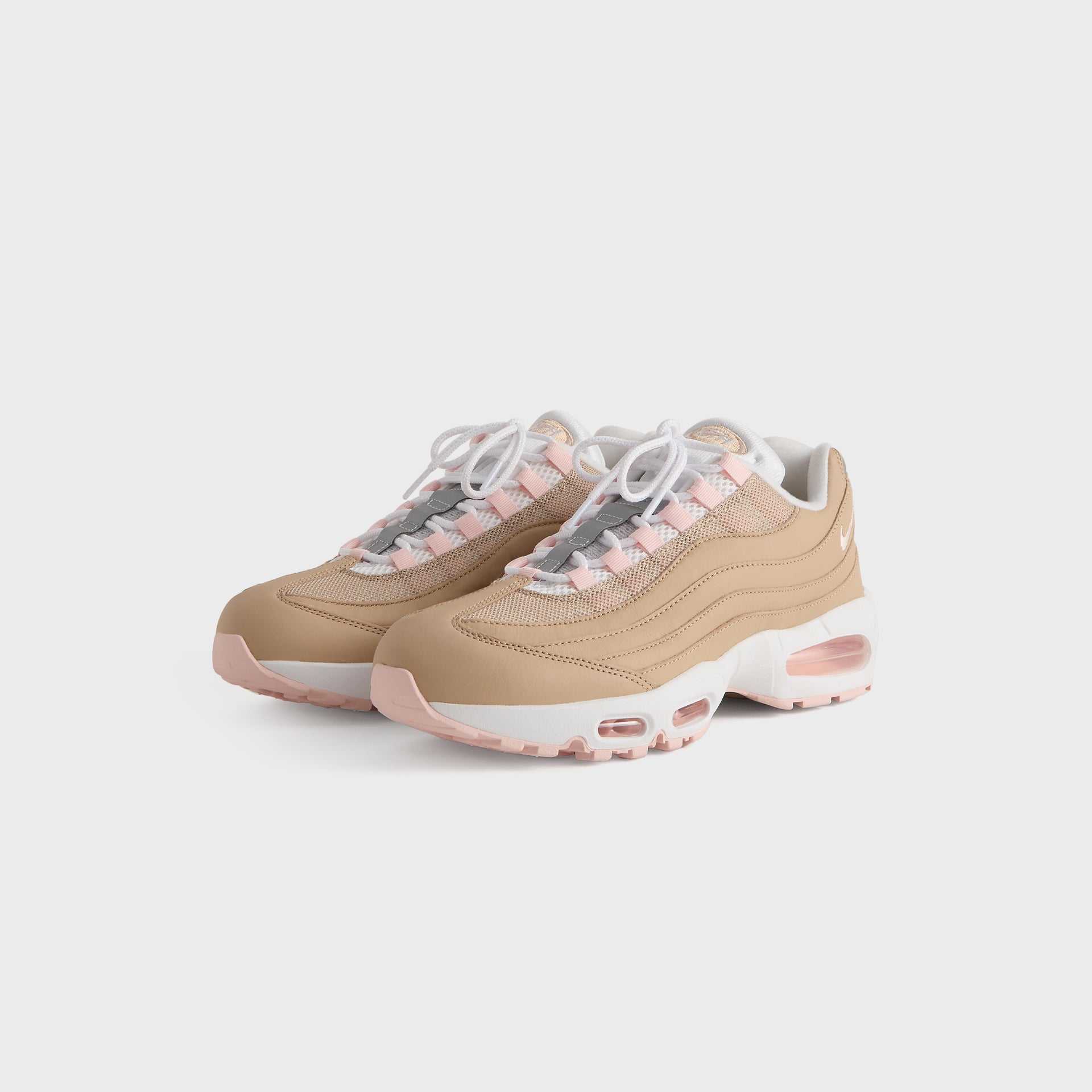 Kith x Nike Air Max 95 Linen pair angled from the front, linen upper with pink accents and white laces