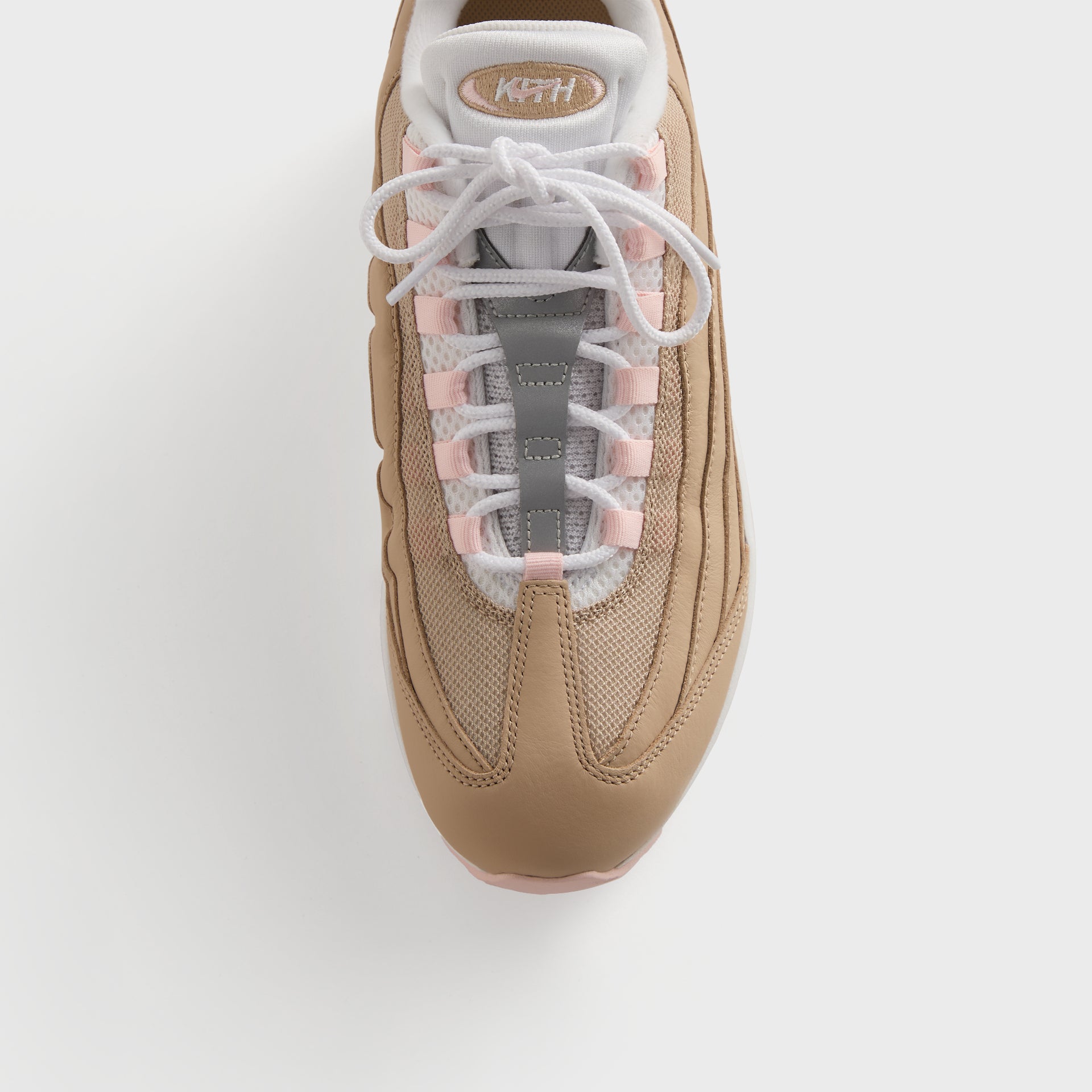 Top-down of a single Kith x Nike Air Max 95 Linen showing the Kith-branded tongue