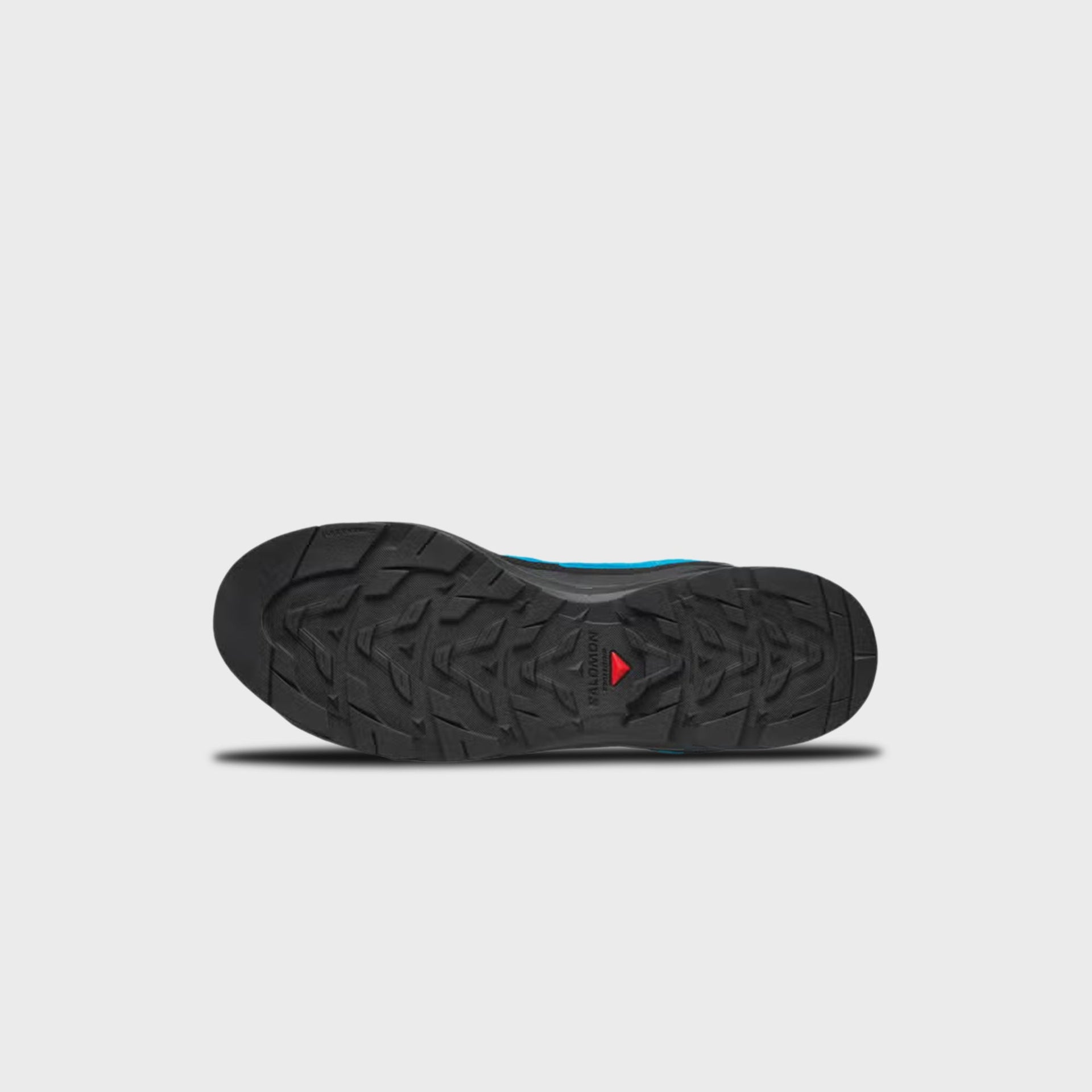 Salomon X-ALP LTR hiking shoe outsole showing black Contragrip chevron lug tread pattern