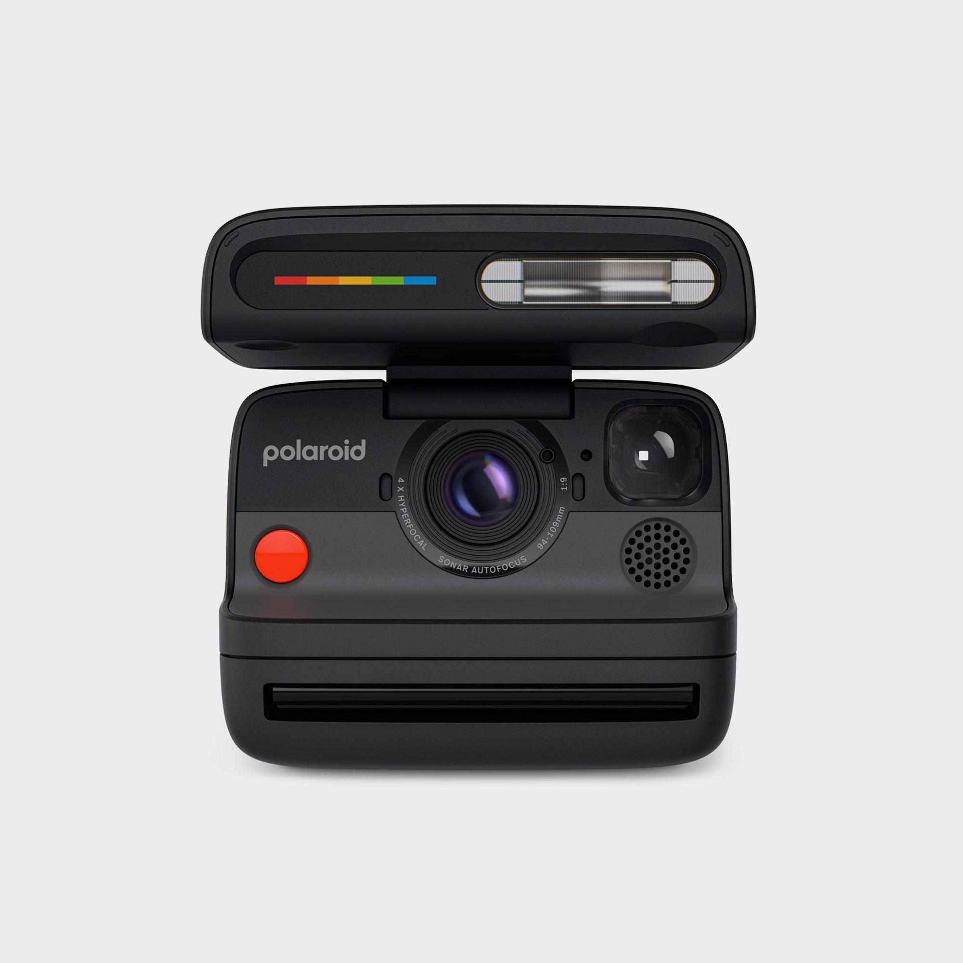 Polaroid Flip instant camera in black, front view with flash lid open, red shutter and hyperfocal sonar autofocus lens