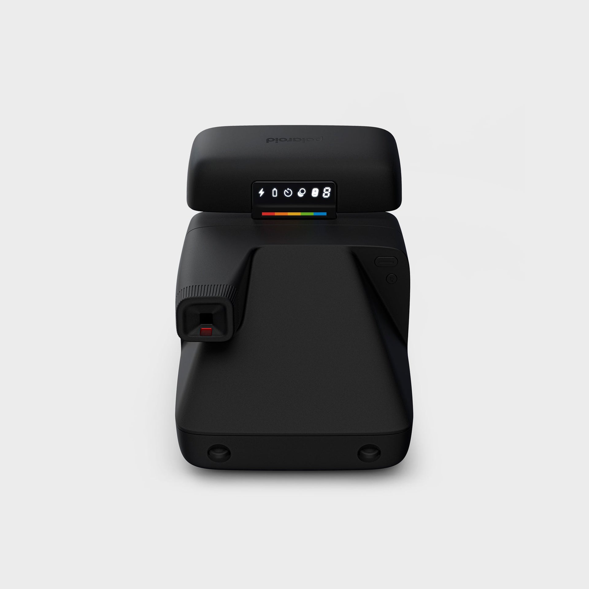 Polaroid Flip black camera from above showing the top LCD icon panel, rainbow stripe and pop-up viewfinder