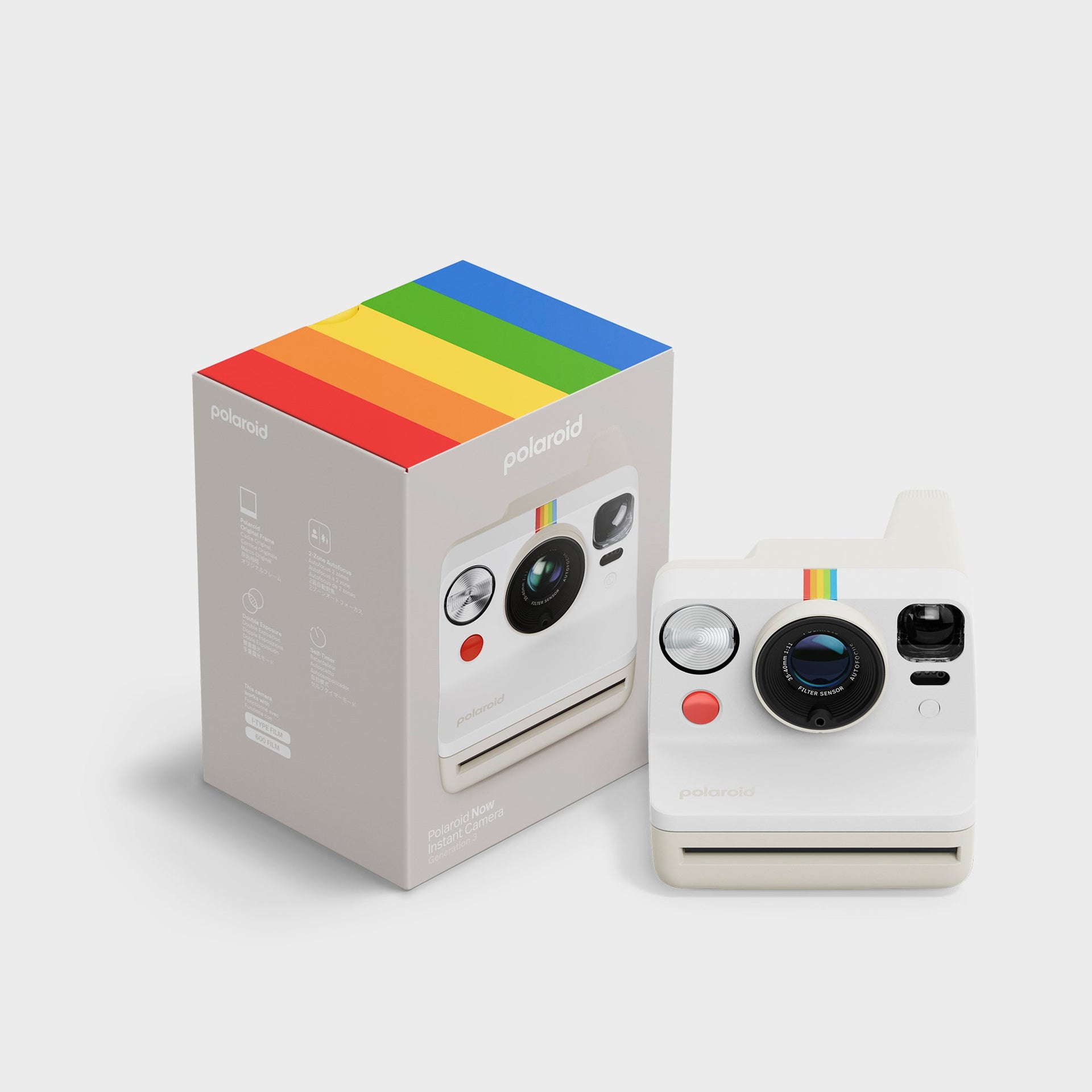 Polaroid Now Gen 3 pebble white camera beside its grey rainbow-topped retail box