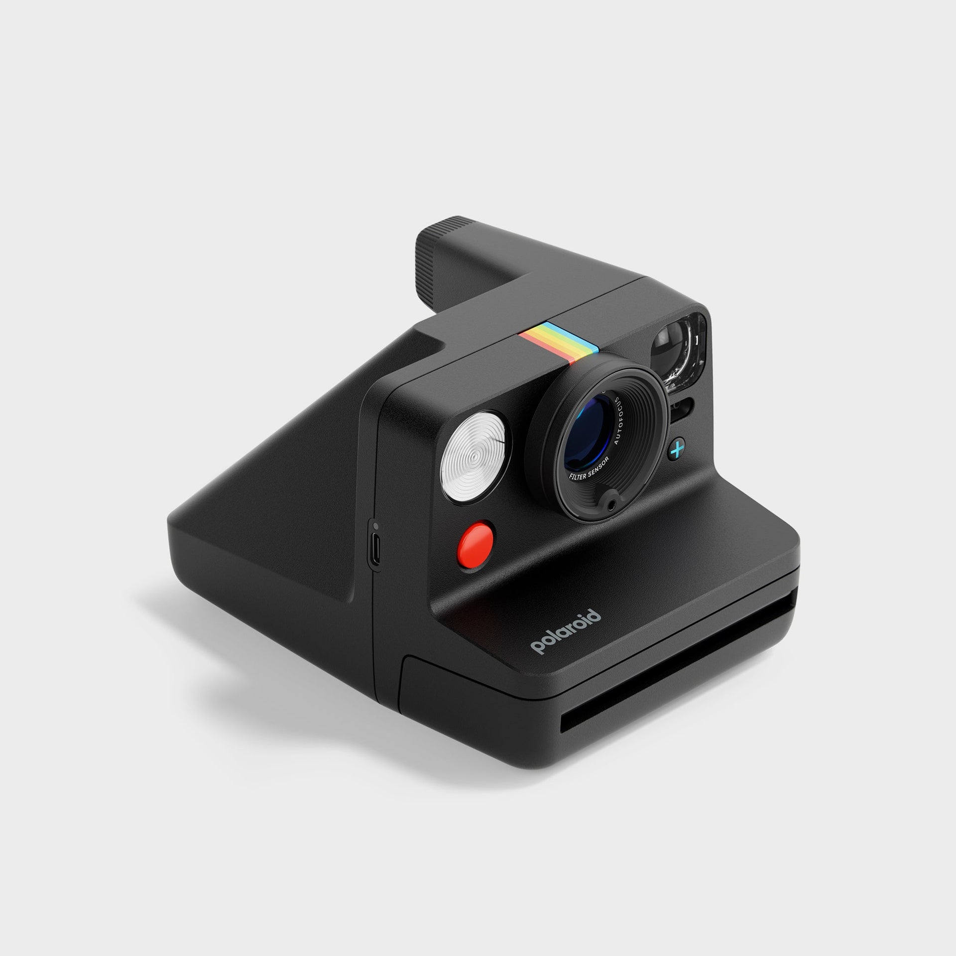 Polaroid Now Gen 3 black instant camera at a three-quarter angle with USB-C port and red shutter visible