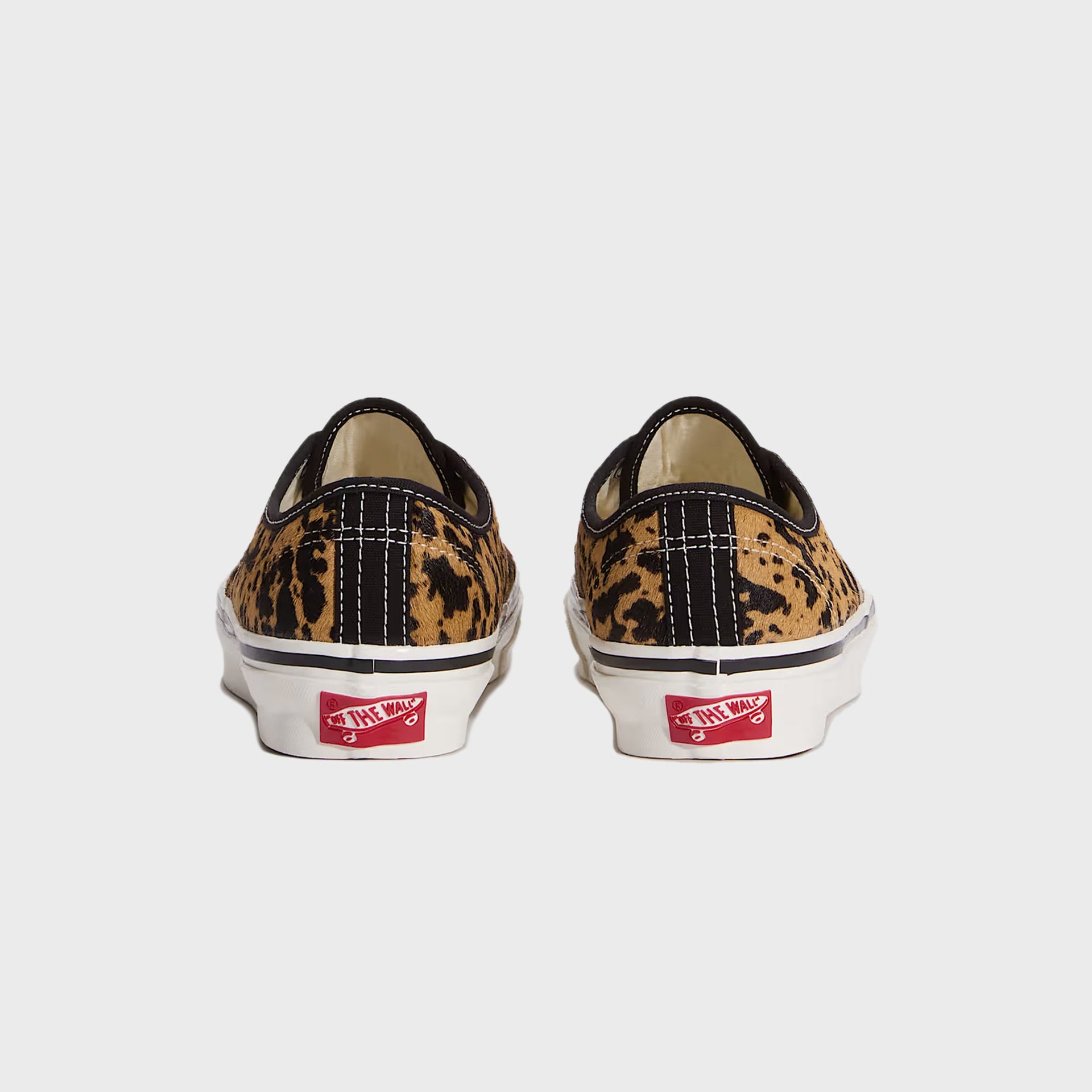 Pair of VANS LX Authentic 44 sneakers in cow-print calf hair, rear heel view with red Off The Wall patch