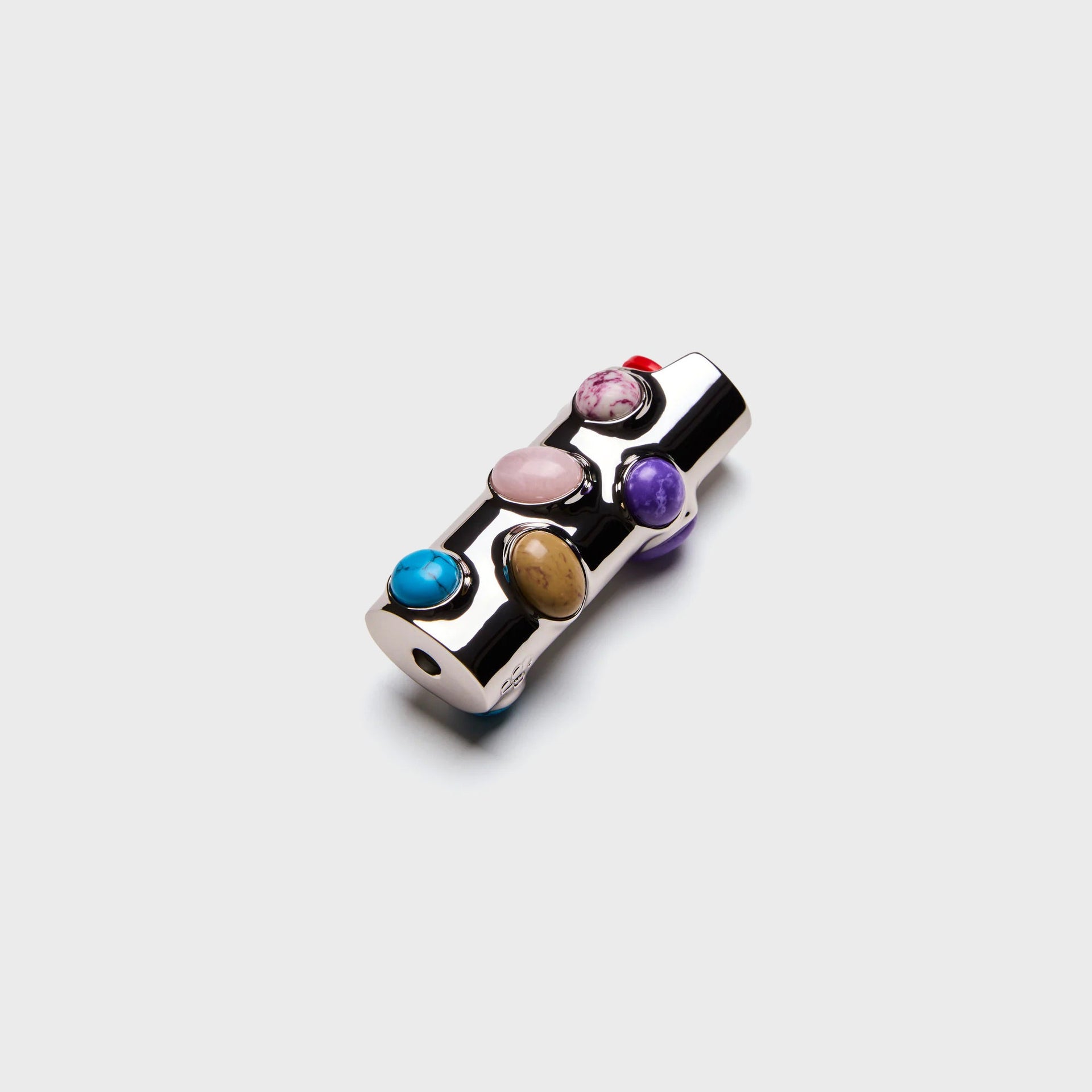 Edie Parker Stoned chrome lighter case, top angle showing red, pink-veined and rose quartz stone cabochons
