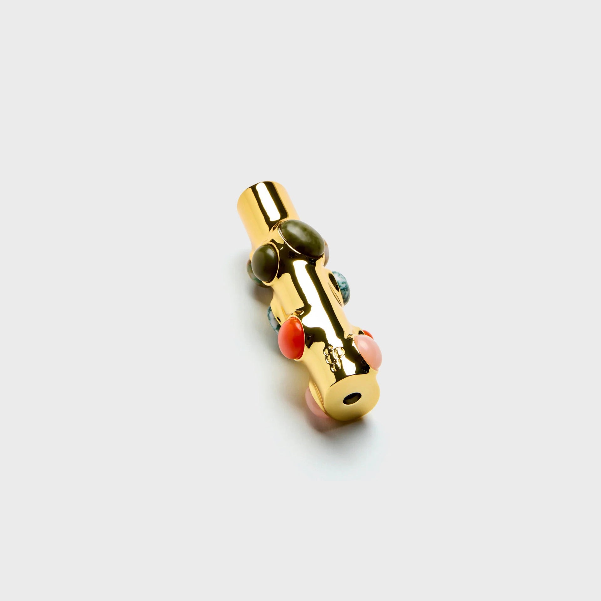 Edie Parker Stoned lighter case, reverse angle showing gold base opening and cabochon-studded body