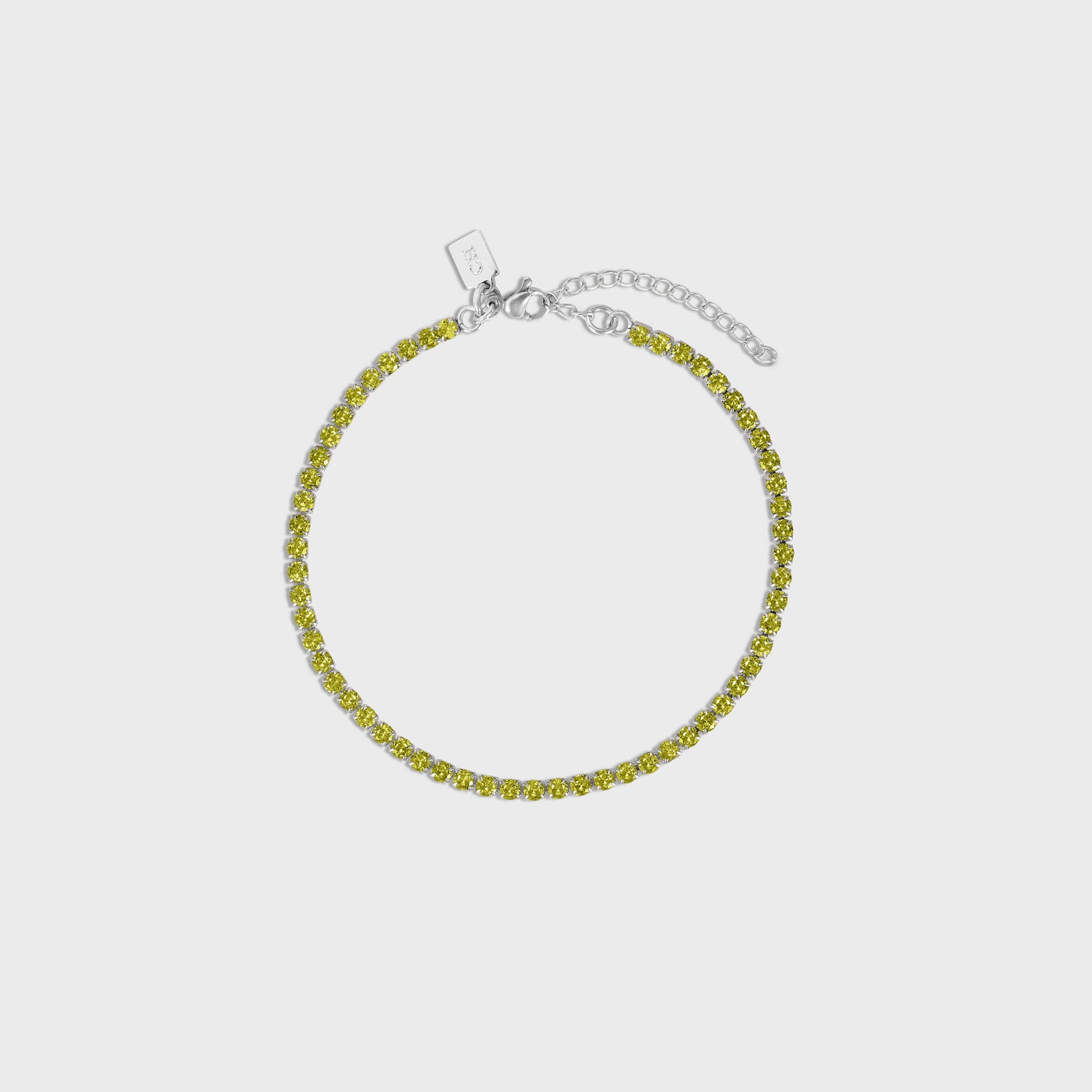 Crystal Haze Serena anklet, olive-green crystal tennis chain in silver coiled flat with clasp and CH tag