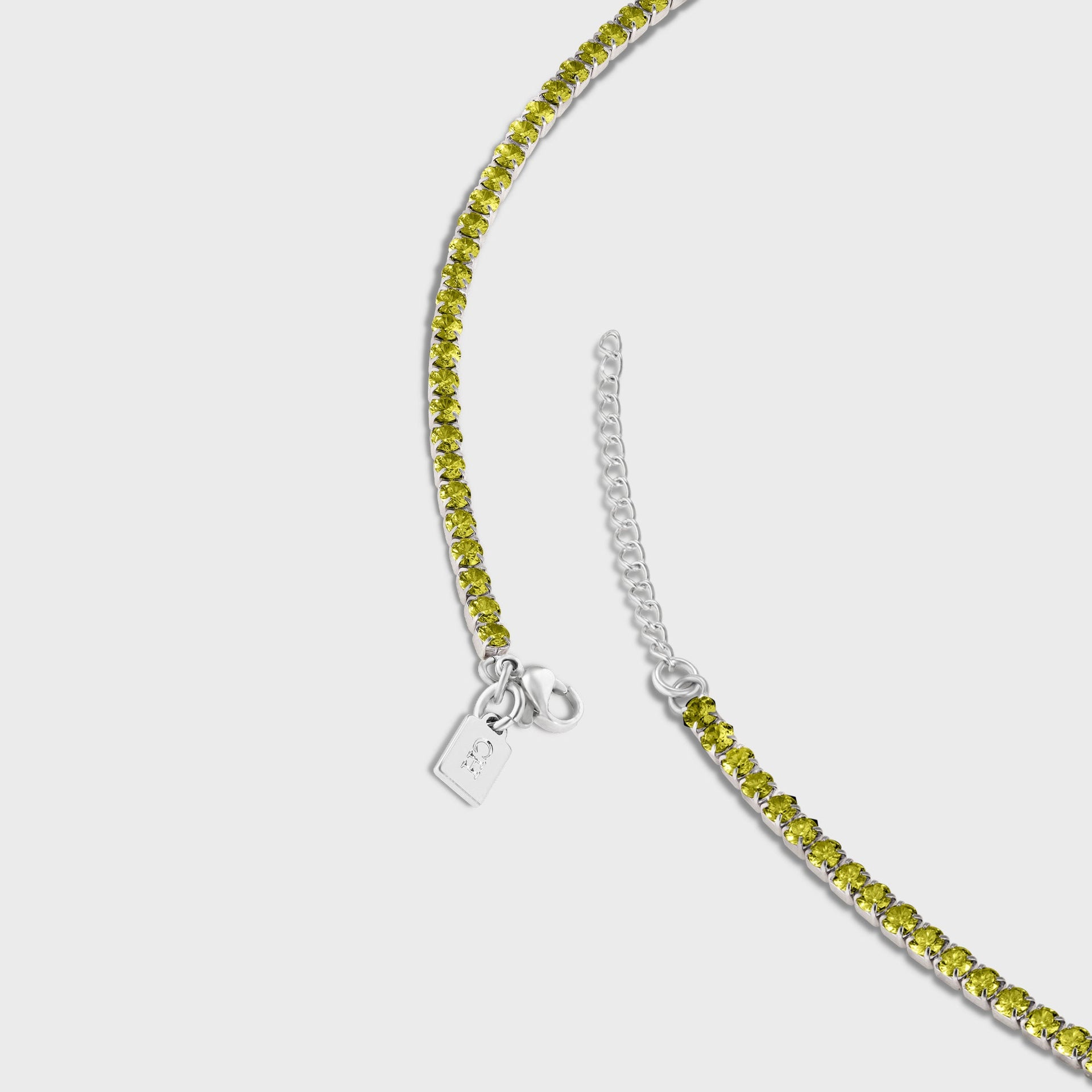 Crystal Haze Serena anklet, close-up of clasp, extender chain and CH tag with olive-green crystals