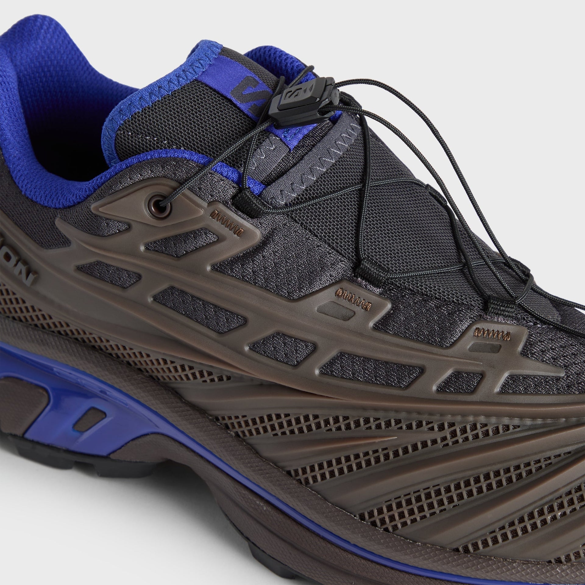 Kith for Salomon XT-EVO close-up, brown mudguard mesh and black quicklace lockdown detail