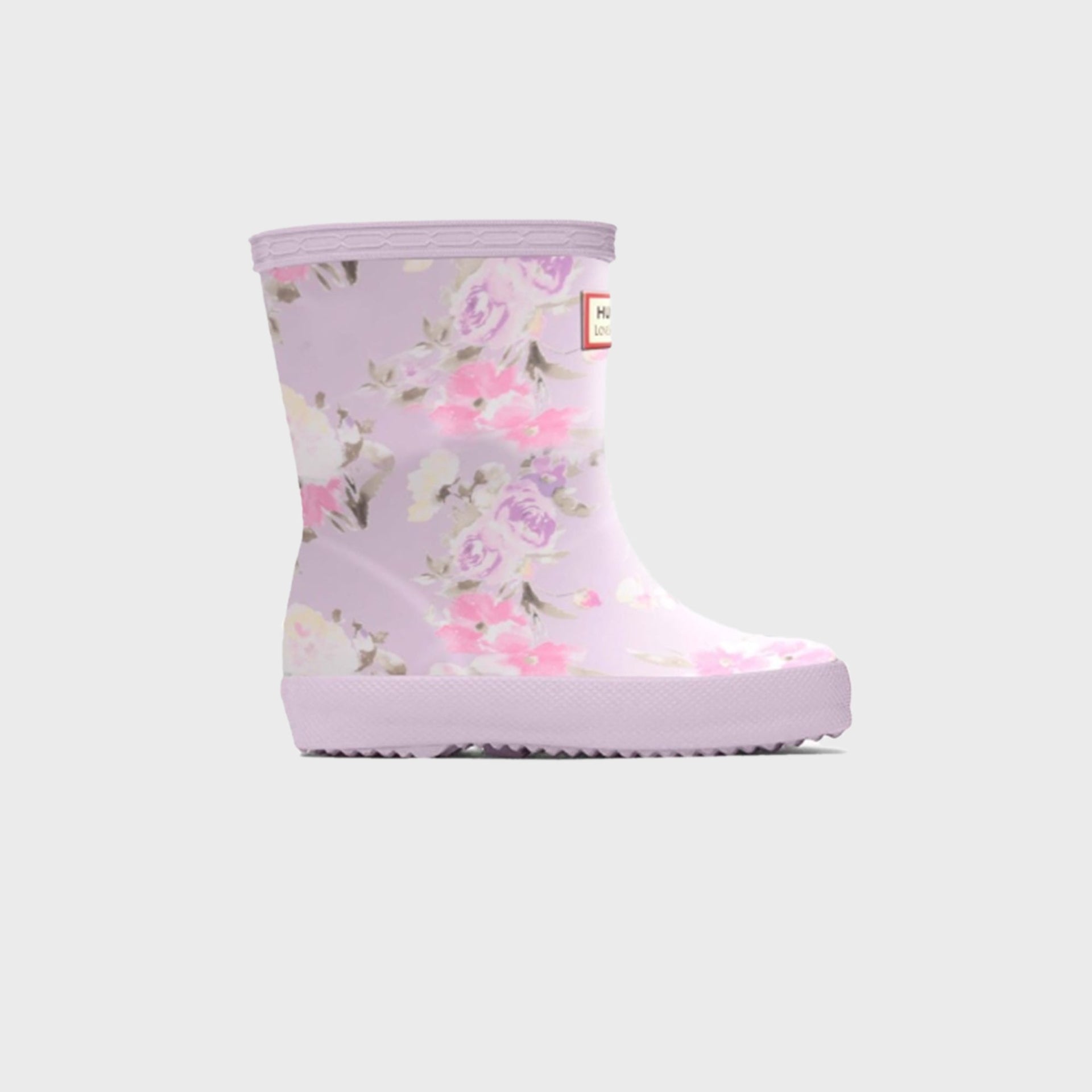 Hunter x LoveShackFancy kids First Classic rain boot in lilac with a painterly pink and purple rose floral print, side view