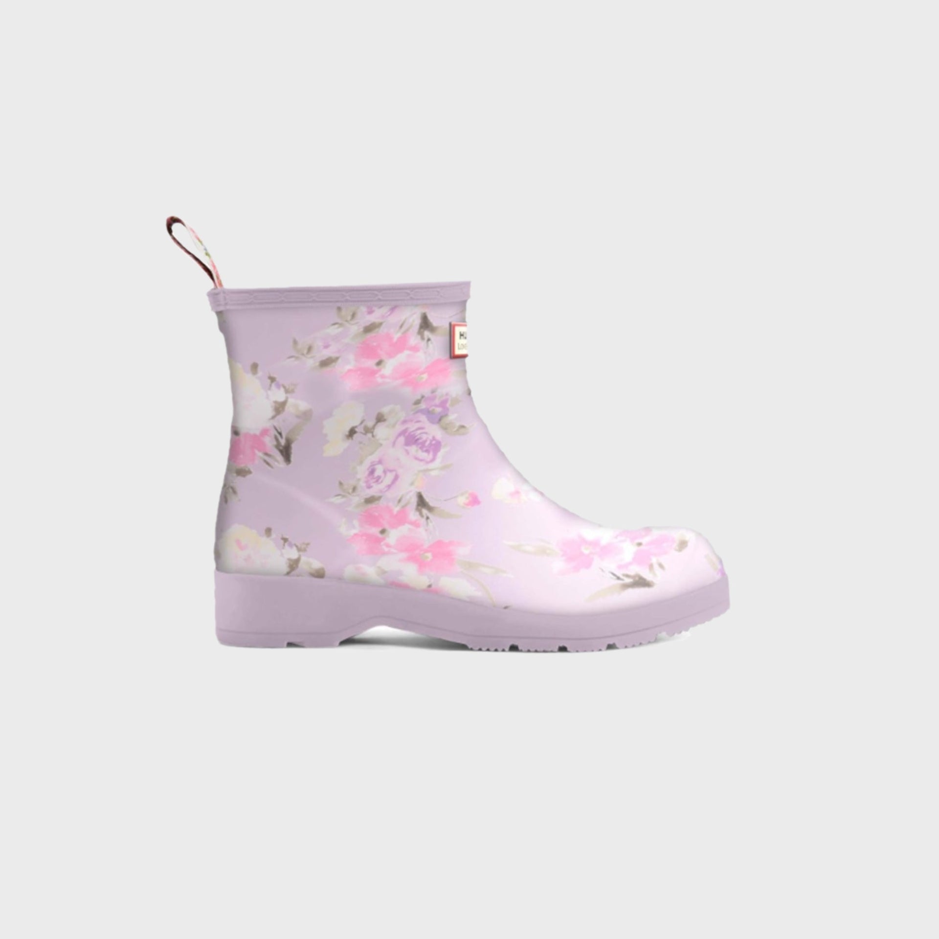 Hunter x LoveShackFancy women's Play Short ankle rain boot in lilac with a painterly rose floral print and pull loop, side view