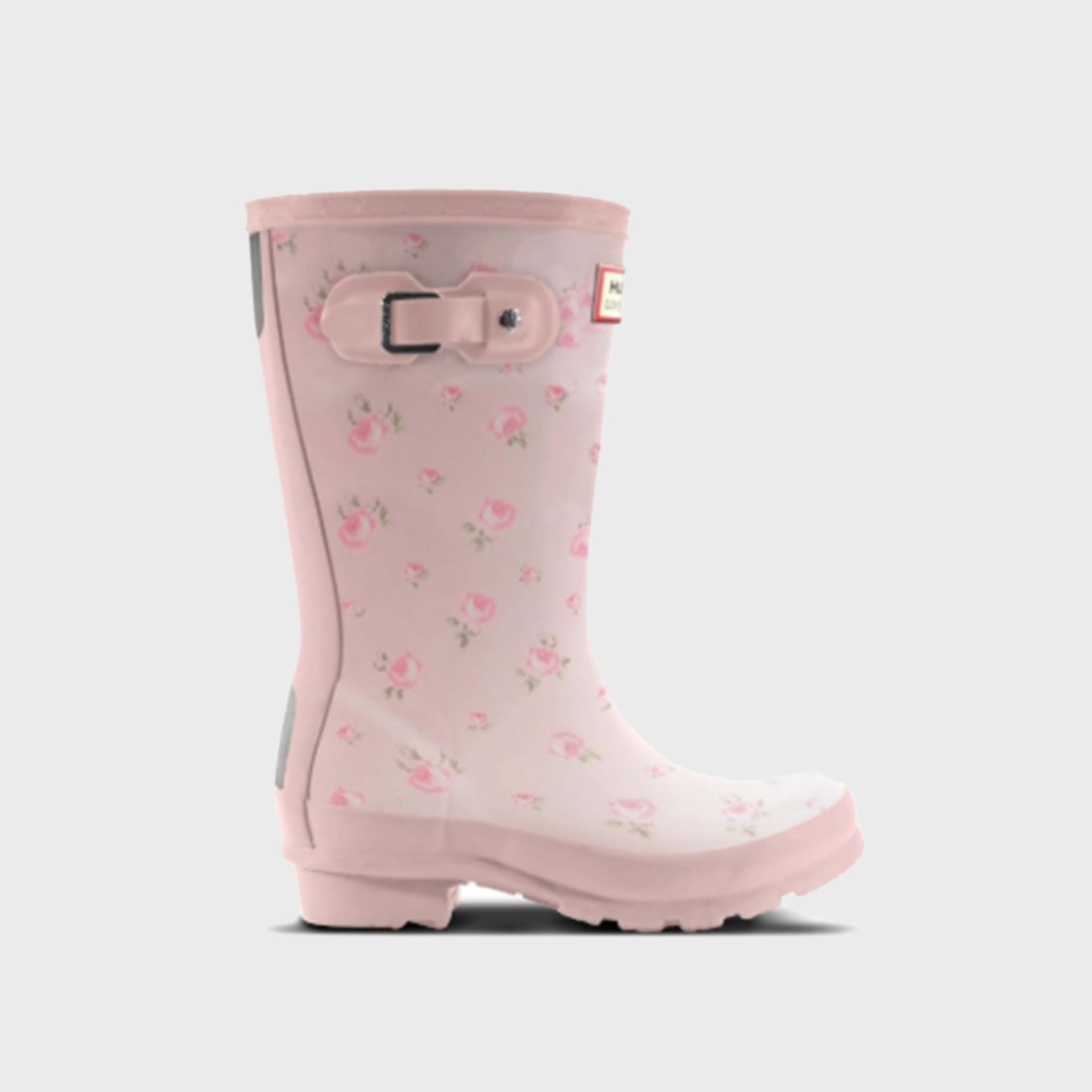 Hunter x LoveShackFancy kids Original rain boot in pale pink with pink rose ditsy print and a buckle strap, side view