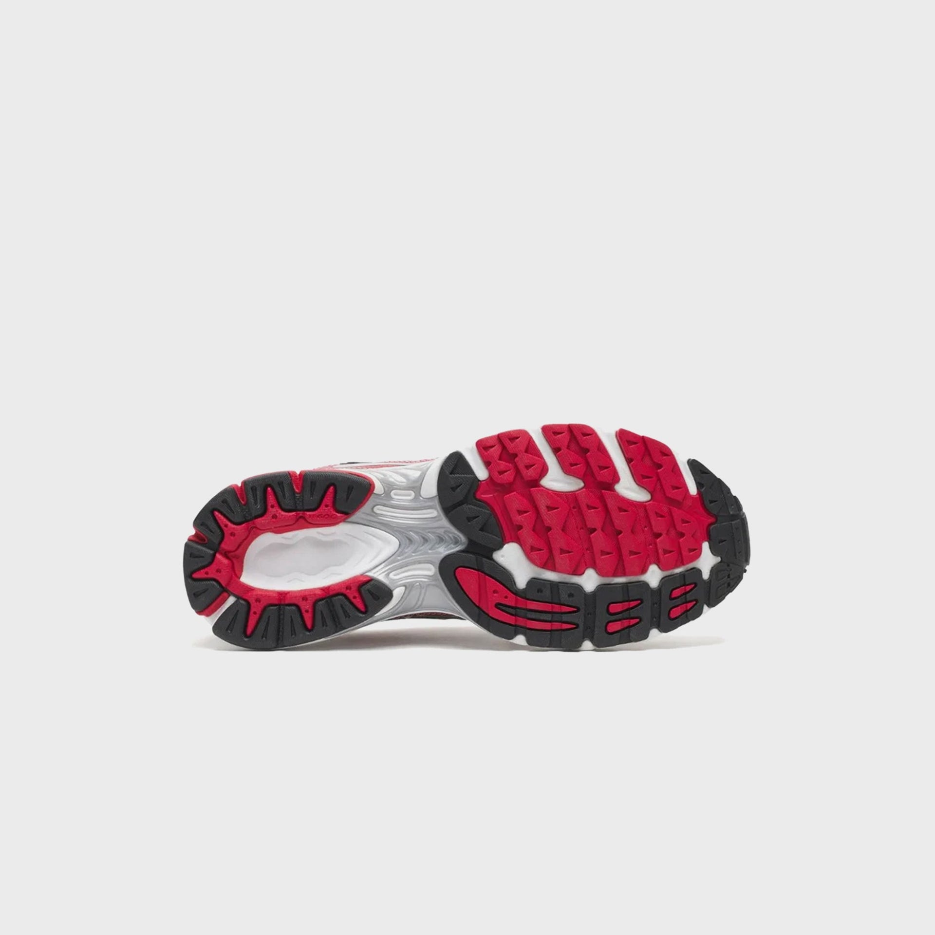 Saucony Progrid Ride 1 running shoe outsole showing red and black segmented ProGrid tread pattern