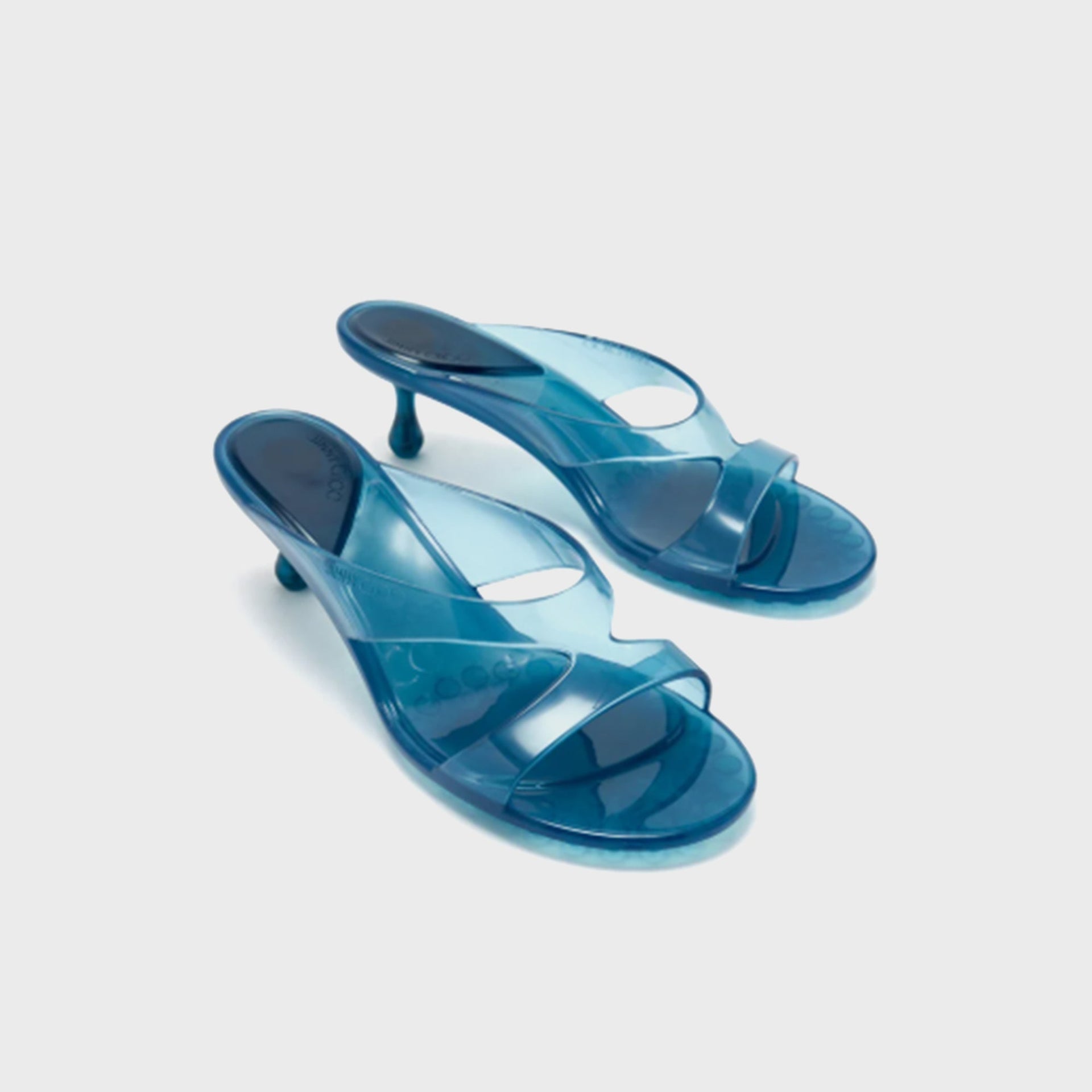 Pair of Jimmy Choo Jelly Drop 50 mule sandals in translucent light lagoon blue jelly, front three-quarter view