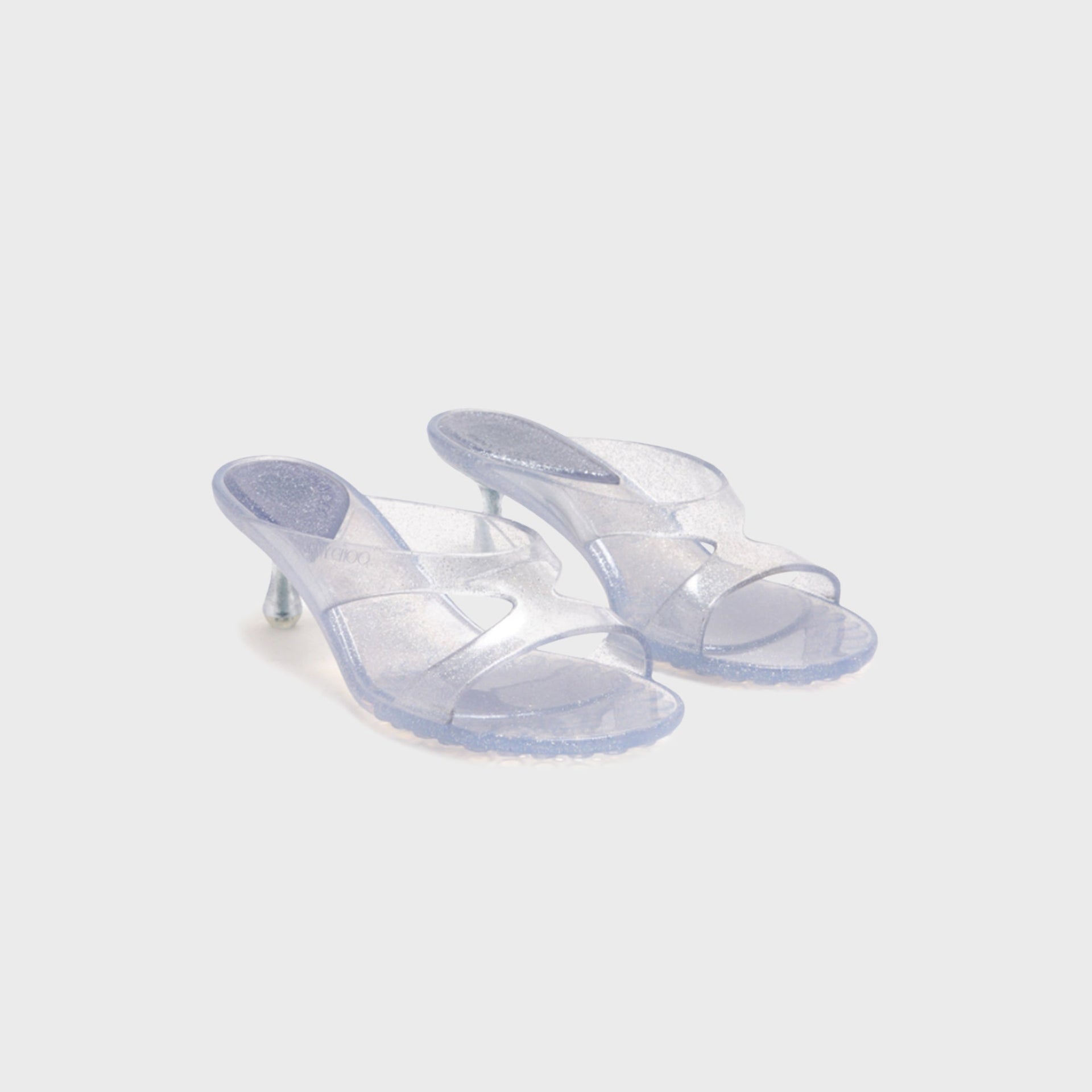 Pair of Jimmy Choo Jelly Drop 50 mule sandals in glitter silver translucent jelly, front three-quarter view