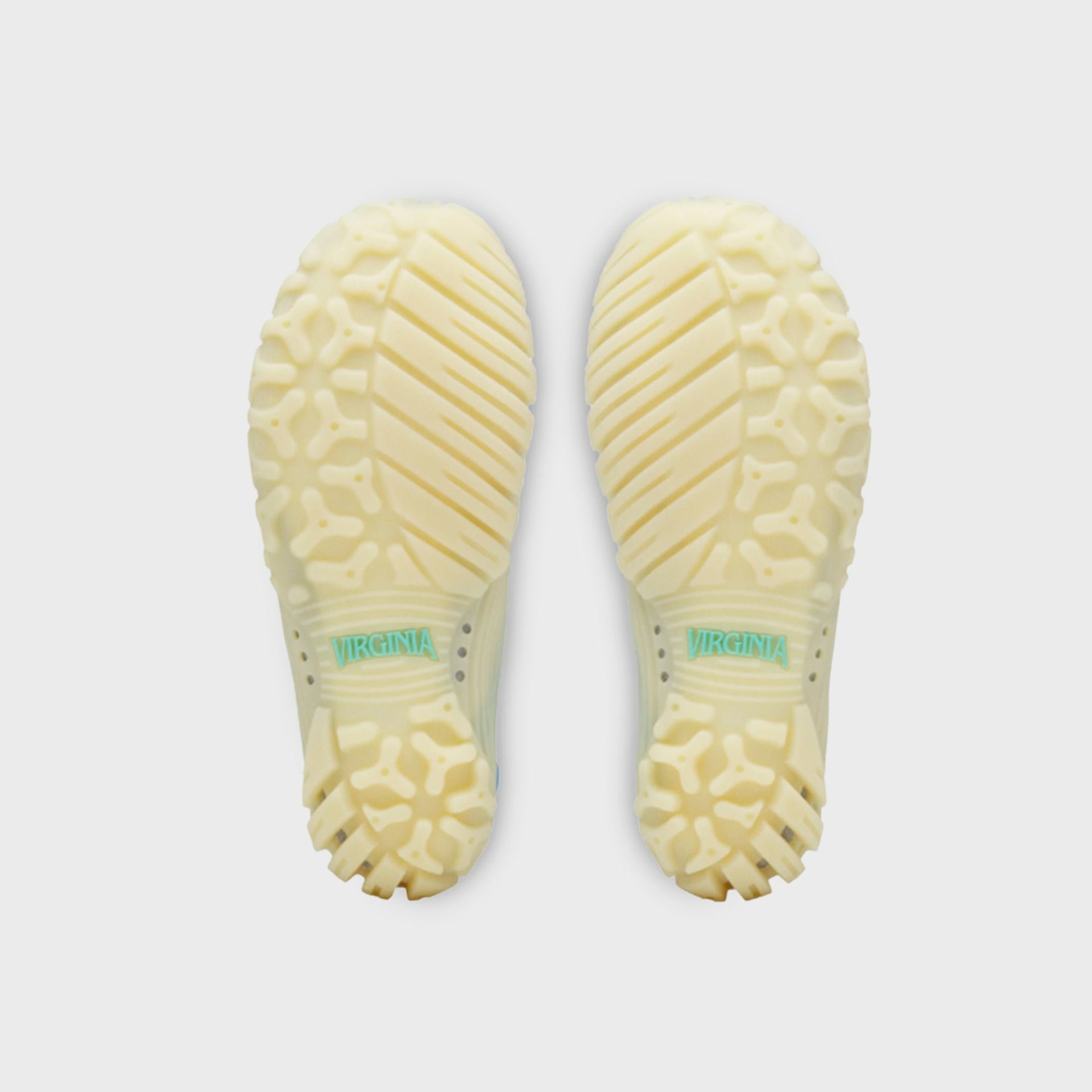 adidas x Pharrell Williams Water Moc outsole view, translucent cream rubber lugs with Virginia text detail