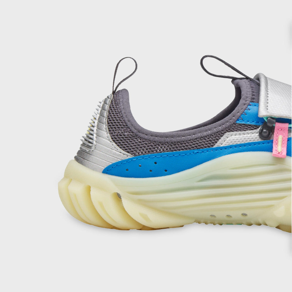 adidas x Pharrell Williams Water Moc close-up of heel collar and blue textile panel with pink pull-tab hardware