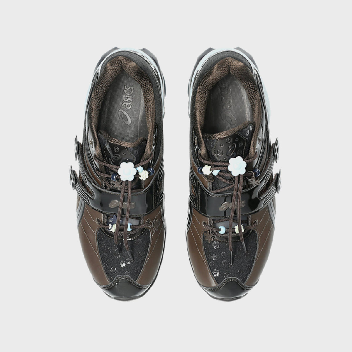 Top-down view of ASICS x Cecilie Bahnsen GEL-KINETIC FR pair showing floral lace toggles and ASICS branded insole