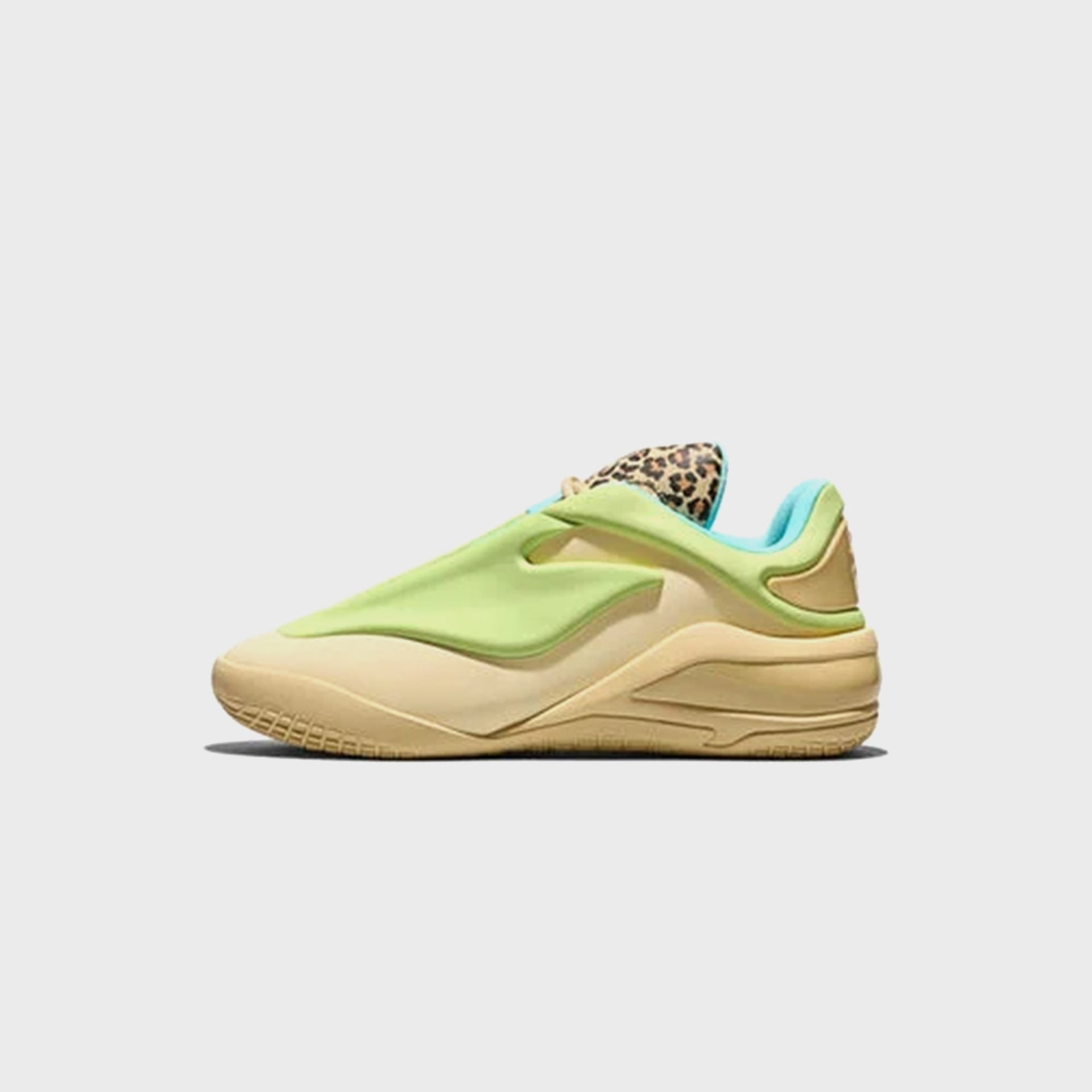 Converse SHAI 001 basketball sneaker in tan with lime green overlay and cheetah-print heel tab, side view