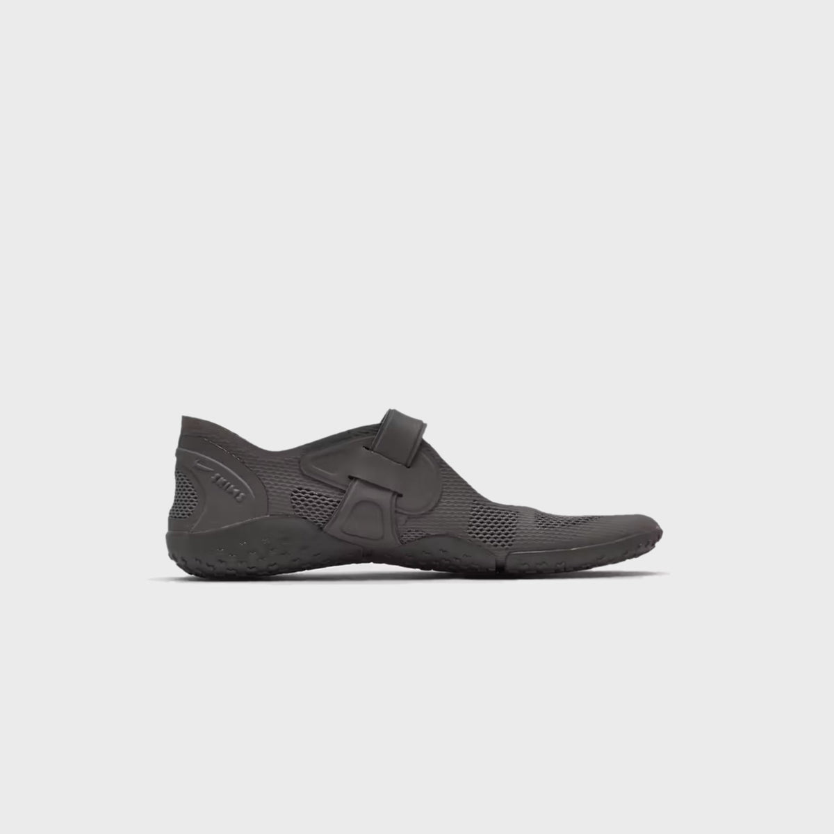 NikeSKIMS Rift 2 Tone Mesh sneaker in Cave Stone, lateral side view showing the split-toe silhouette and hook-and-loop strap