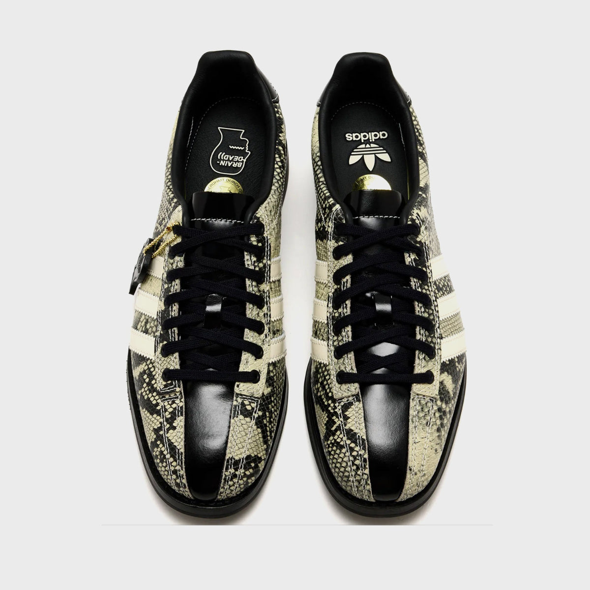 adidas x Brain Dead Samba Bowling shoe in Multi Color / Cream White / Core Black snakeskin-print leather, top-down view of pair with black leather toe cap and black laces