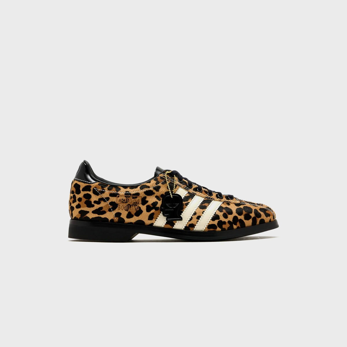 adidas x Brain Dead Samba Bowling shoe in Tan / Black / Cream leopard-print pony hair, lateral view with cream three stripes and black Brain Dead charm