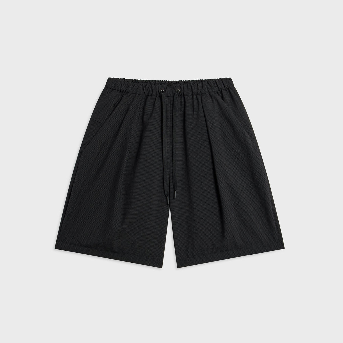 Teatora Wallet Short Resort in grid black, front view with elastic waist, drawcord, pleats and side pockets