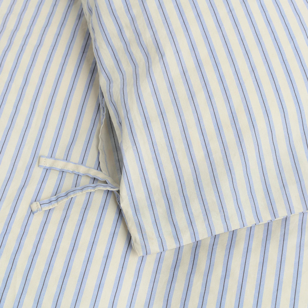 Tekla Percale Double Duvet Cover in Flint Stripes, close-up of the button and tie closure on striped cotton