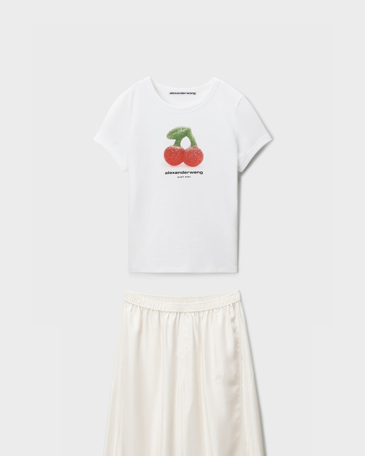 Alexander Wang white cherry-graphic T-shirt and ivory satin midi skirt, flat lay