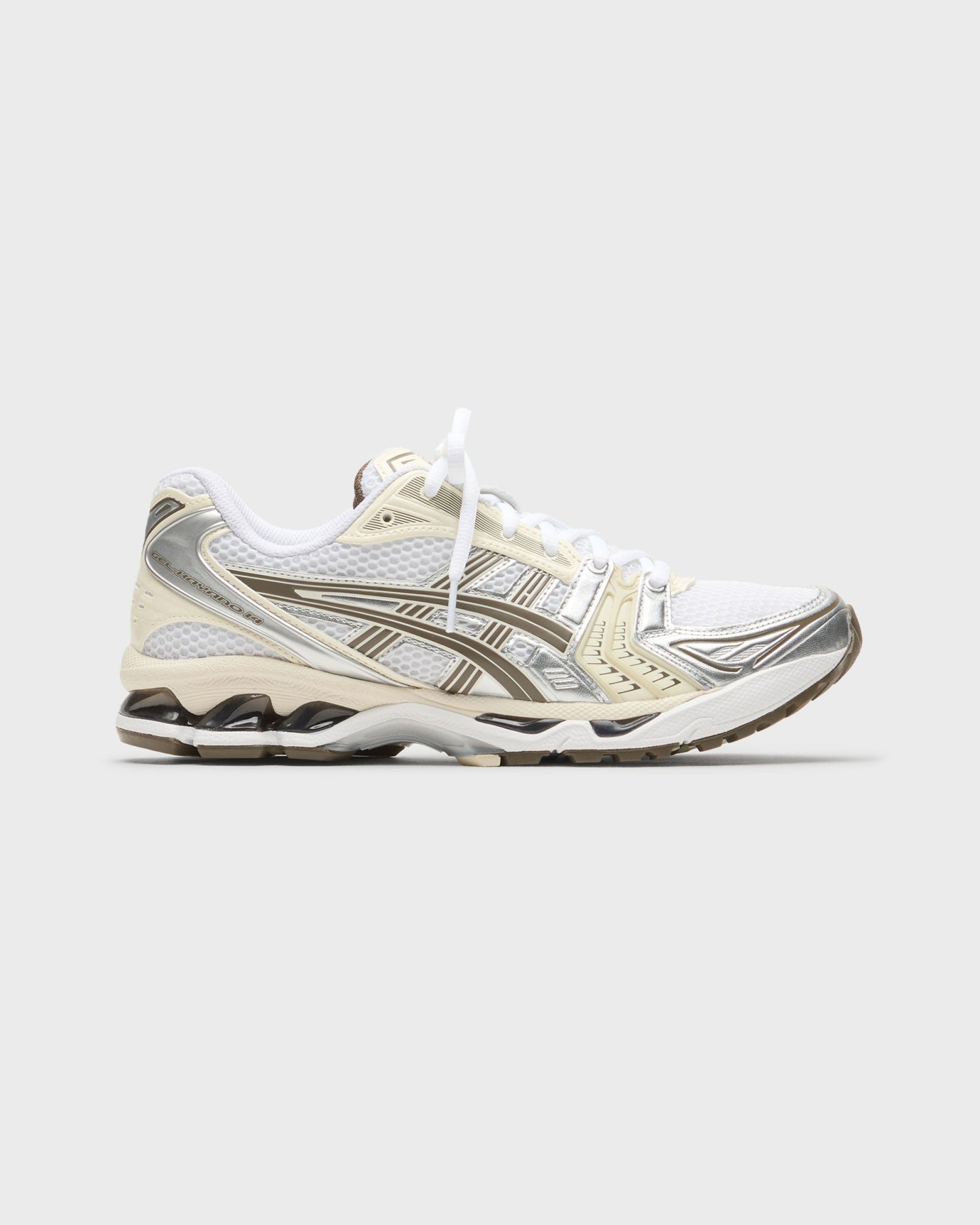 Asics Gel-Kayano 14 white, cream, and taupe running sneaker with silver accents, side view