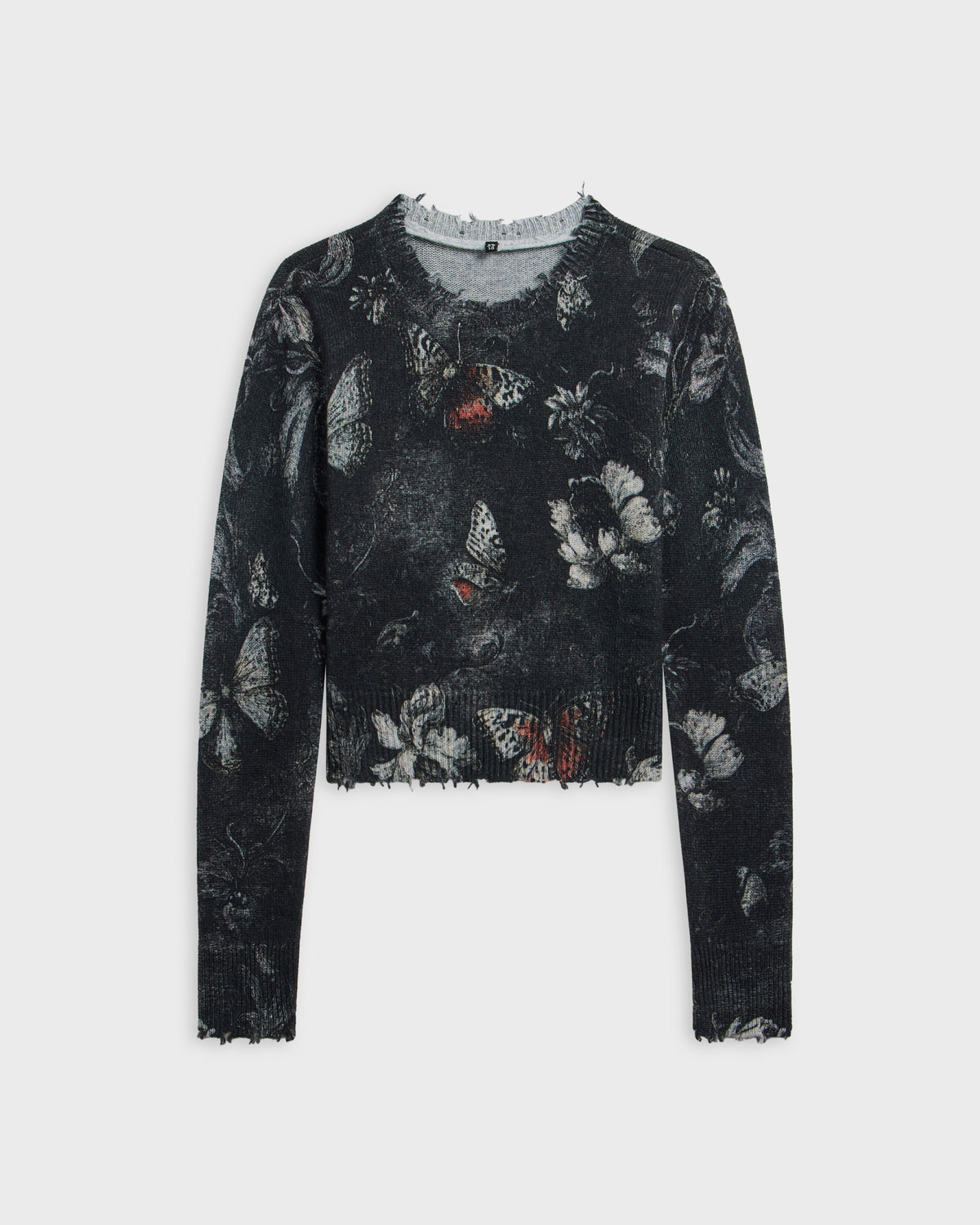 R13 distressed cropped crewneck sweater in black with grey butterfly and floral print and frayed hem and neckline