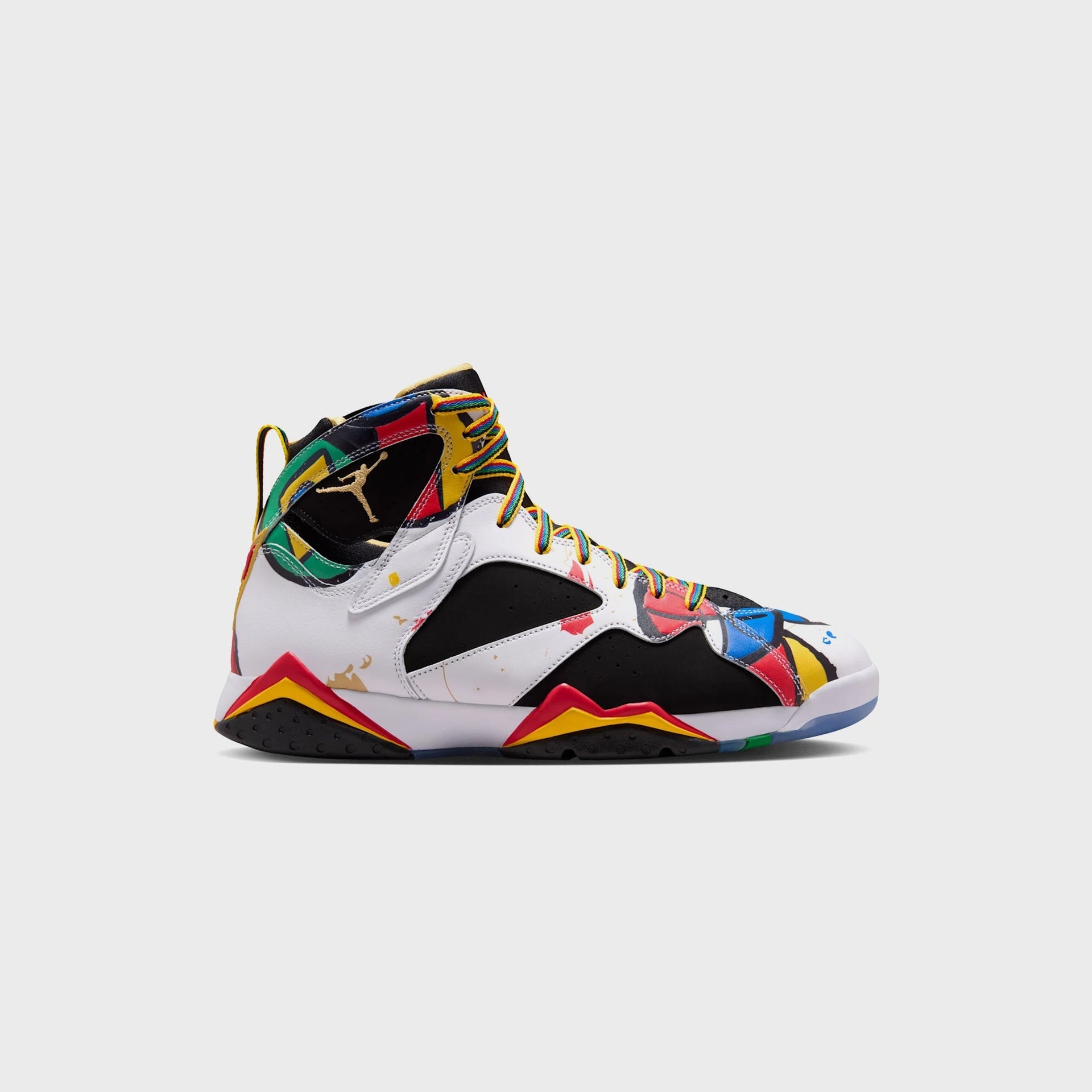 Air Jordan 7 Retro in white leather with black overlays, multicolor Olympic print, gold Jumpman and rainbow laces, lateral view