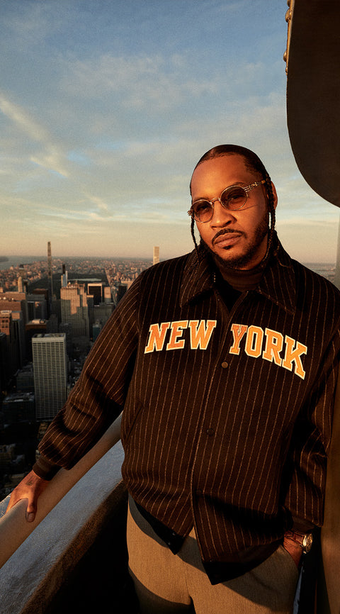 
        Carmelo Anthony wearing a jacket from Kith for the New York Knicks 2023.
      
