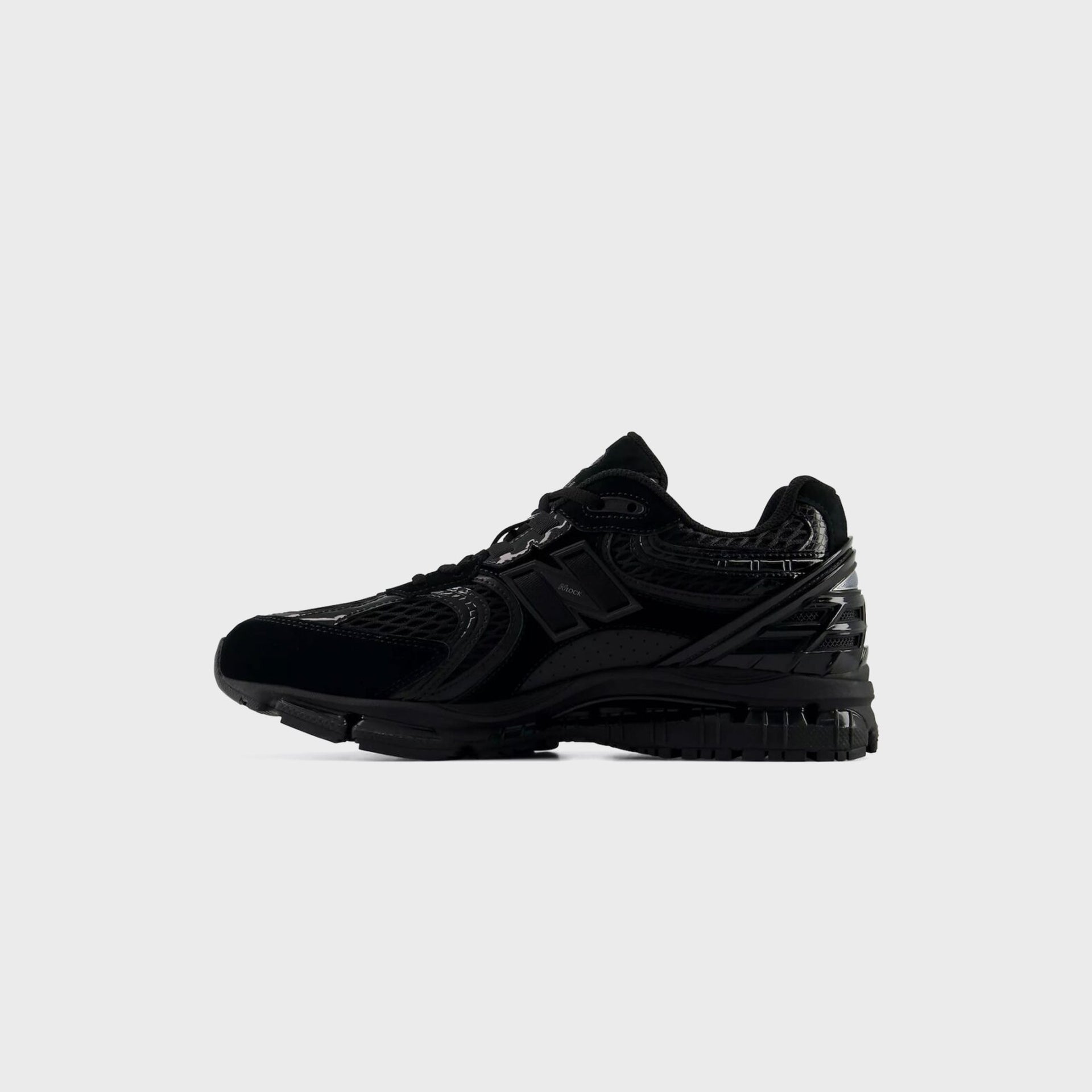 New Balance 1954R in all black with N-Lock detailing, medial inner side profile