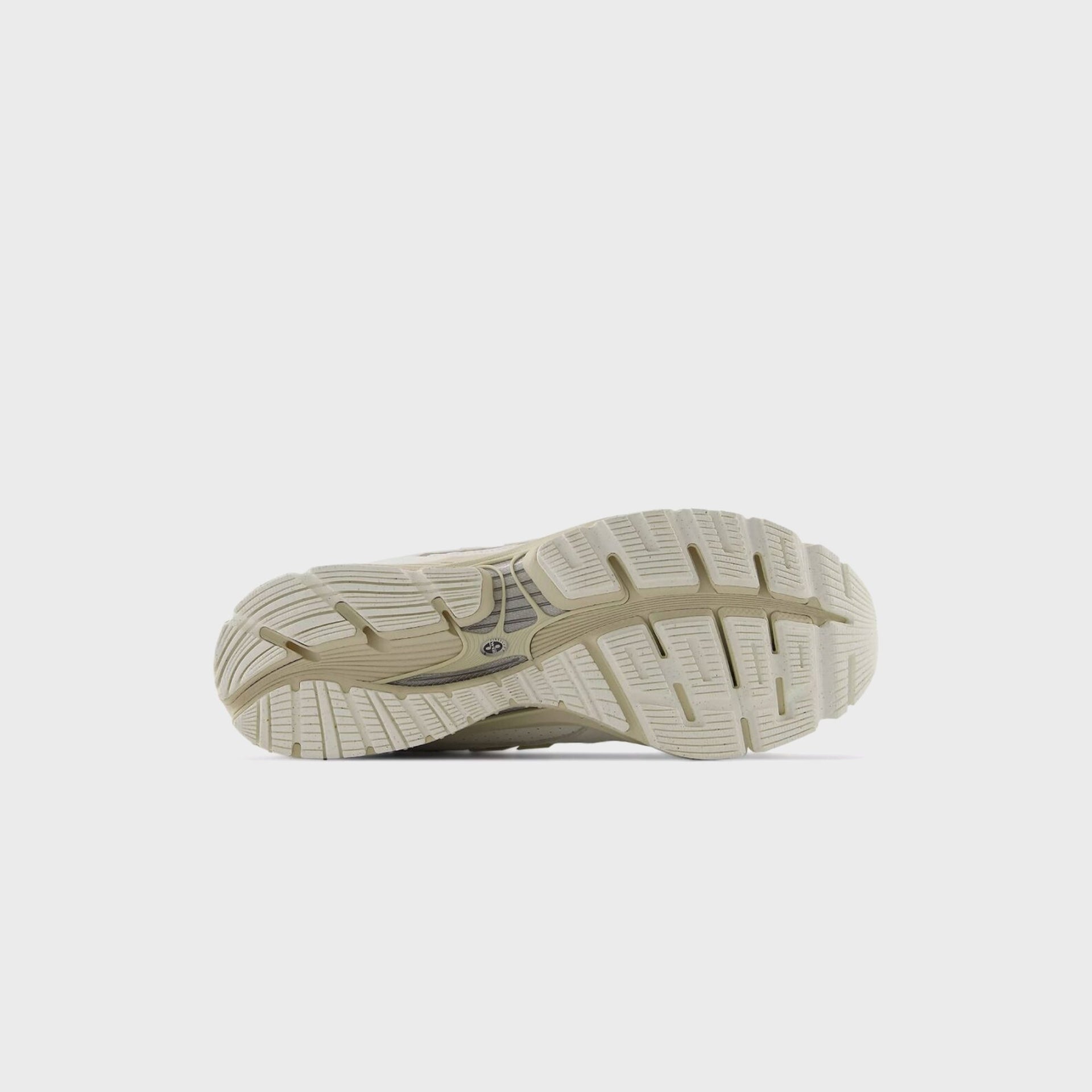 Outsole view of the New Balance 1954R Sea Salt showing its cream lugged rubber sole