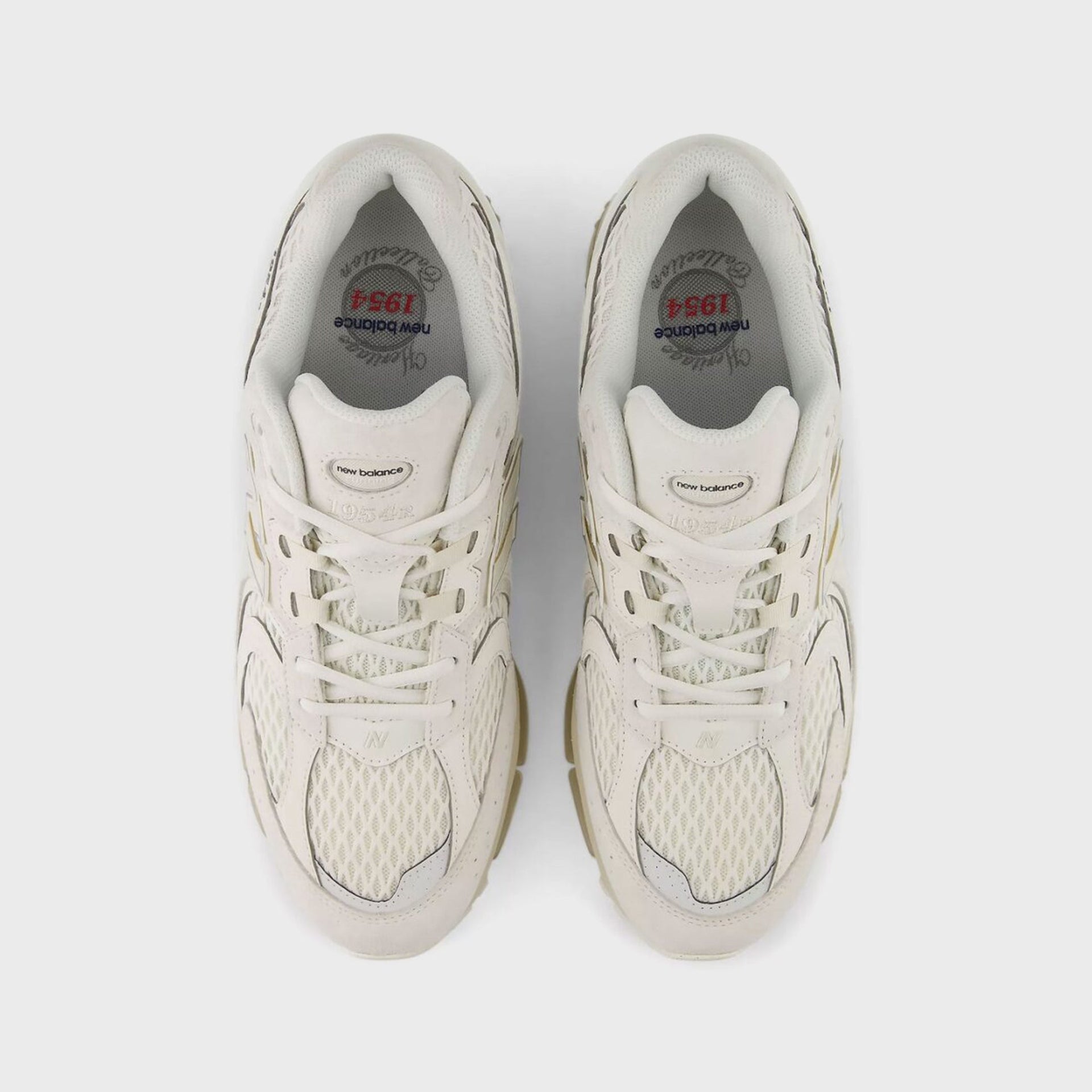 Overhead view of a pair of New Balance 1954R Sea Salt sneakers showing the mesh toe and 1954 Heritage insole branding