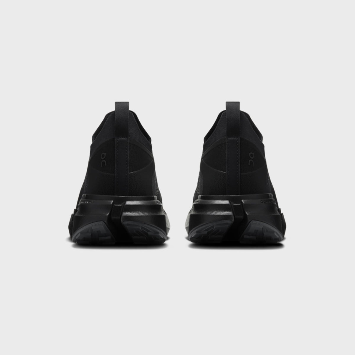 On x Post Archive Faction Cloudsoma sneaker in all-black, rear heel view of pair