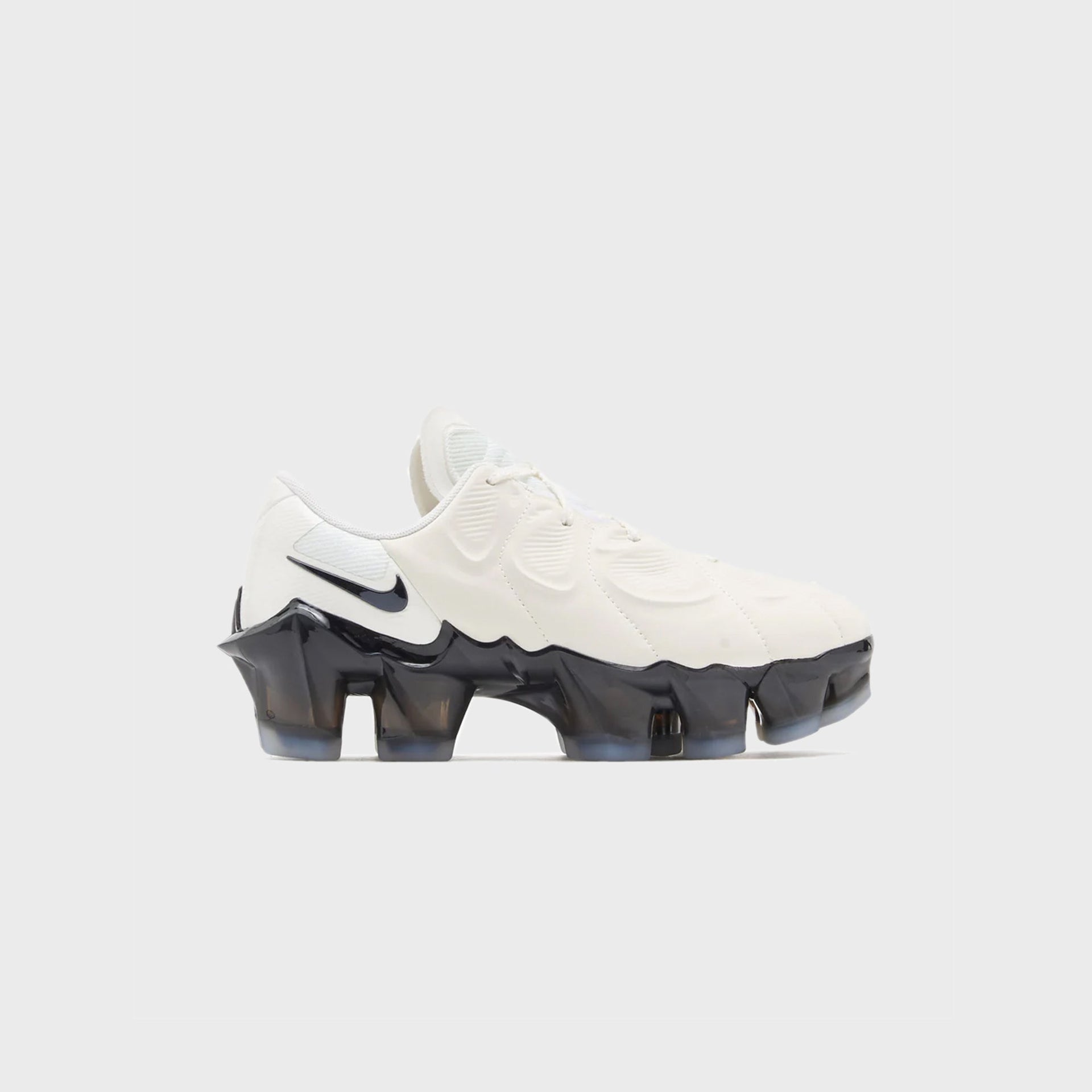 Nike WMNS First Sight Mirage in sail with black Swoosh and sculptural translucent black VaporMax sole, lateral outer view