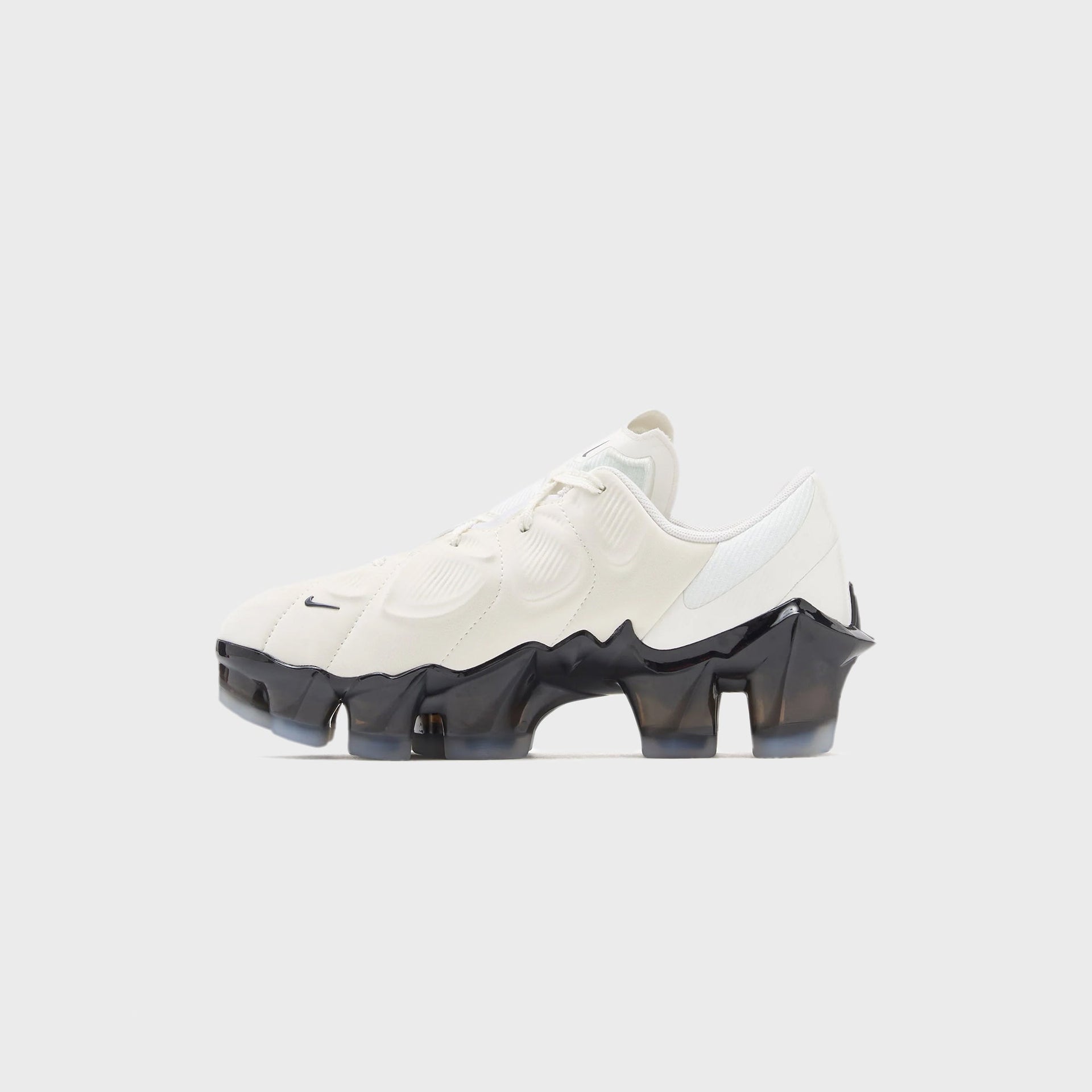 Nike WMNS First Sight Mirage in sail with a small black Swoosh, medial inner side profile over a translucent VaporMax sole