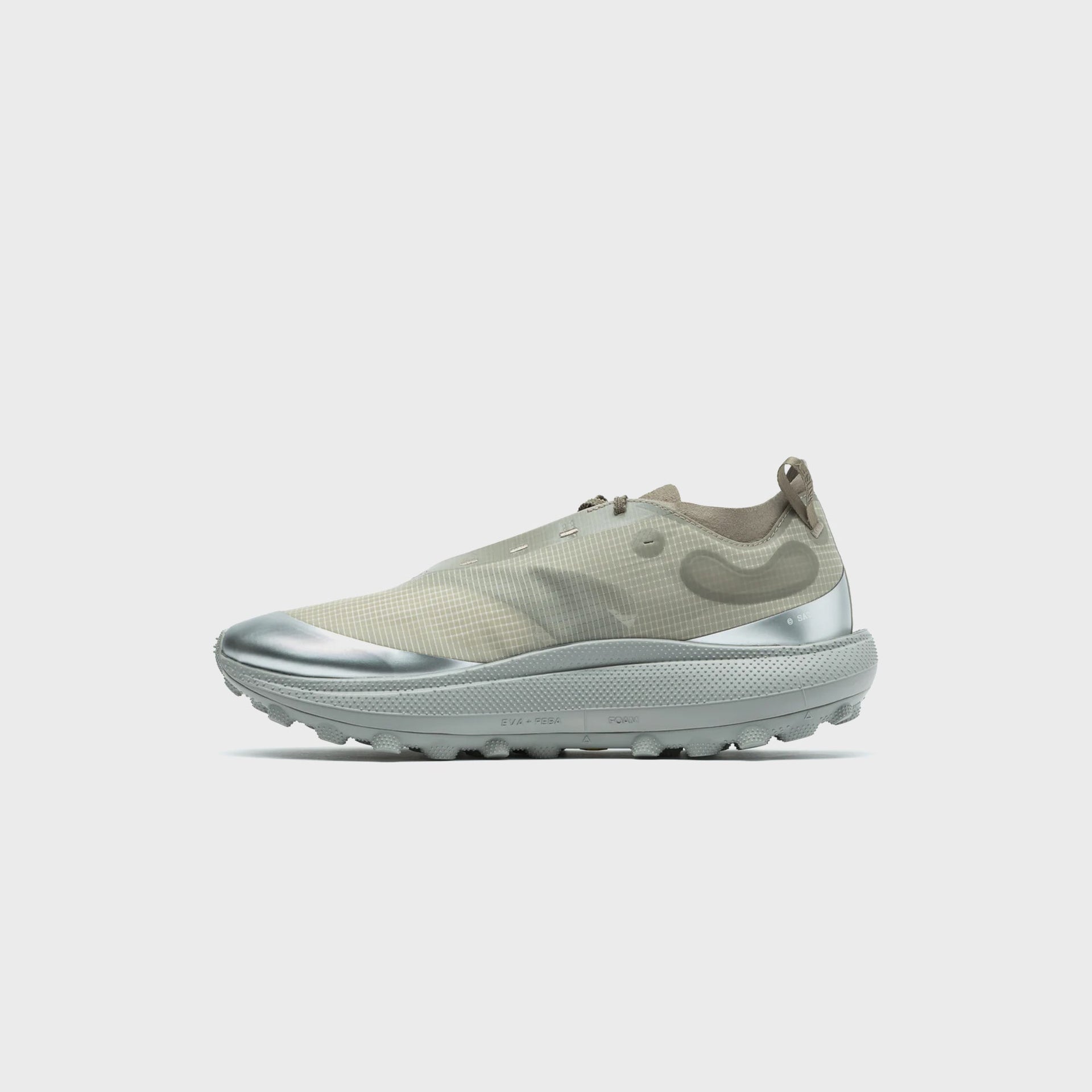 SATISFY TheROCKER sneaker in aluminum grey, medial side view showing EVA + PEBA foam midsole label and silver toe cap