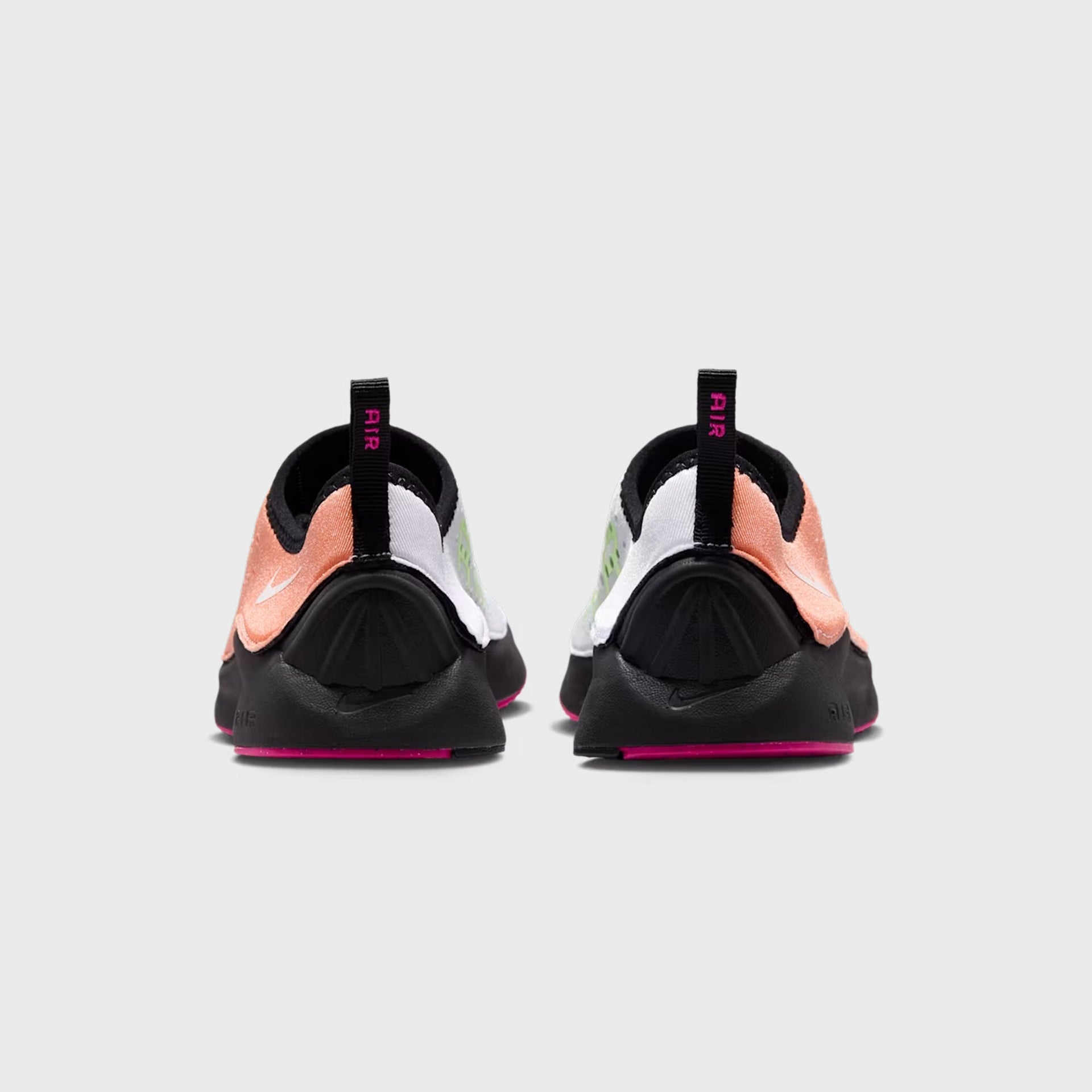 Pair of Nike WMNS Air Superfly Slip Neo SP slip-ons, rear heel view with pink AIR pull tabs and black heel counters