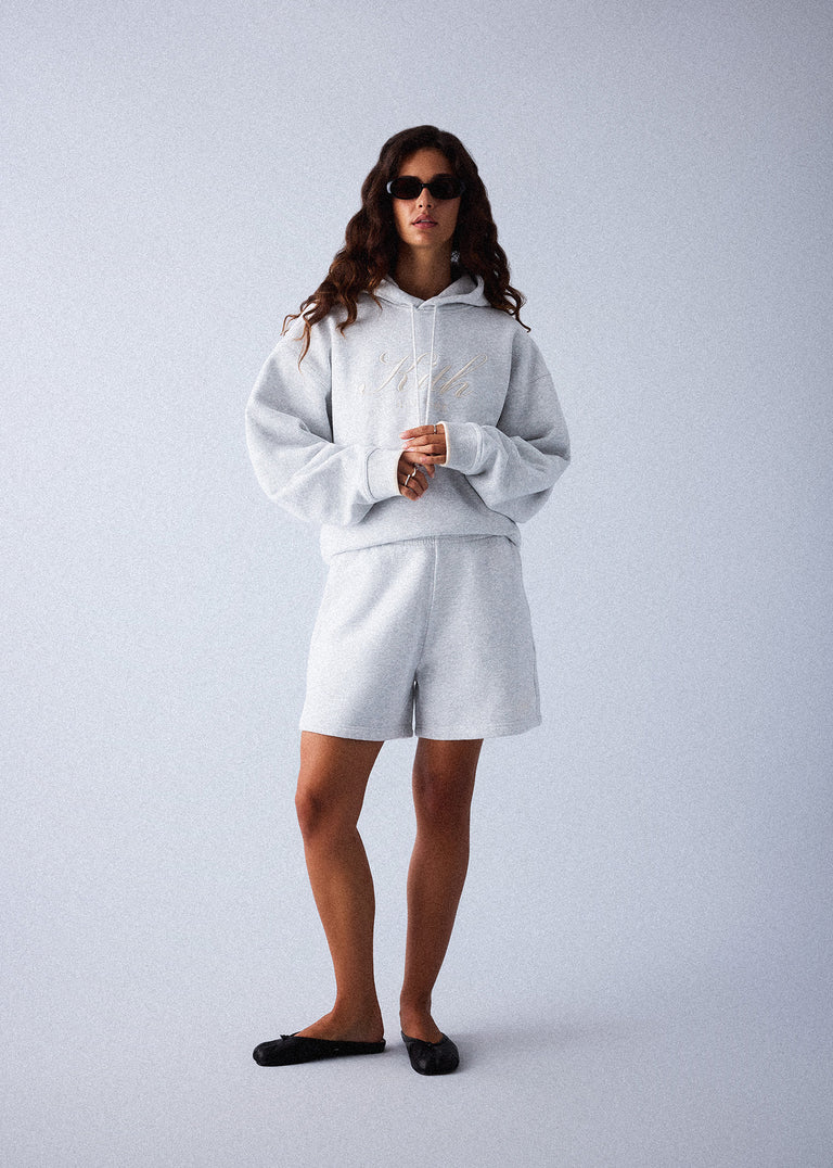 
            A model wearing a sweatshirt and sweat shorts from Kith Women Fall 2024.
          
