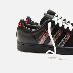 black and red superstar adidas