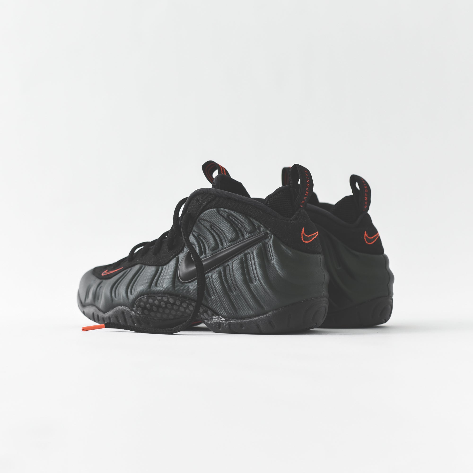 foamposite black white orange